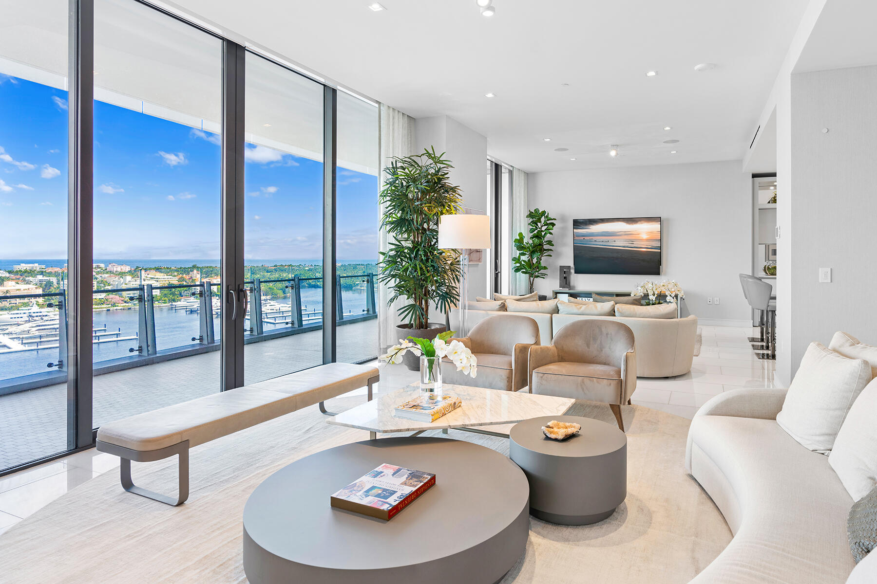DIRECT WATERFRONT at The Bristol, showcasing breathtaking completely unobstructed direct ocean and Intracoastal views from the 14th floor through floor-to-ceiling 11-foot glass throughout. This impressive 3-bedroom plus den residence spans over 4,200 SF total, including two expansive terraces. Enjoy light-filled living with panoramic vistas from every room, offering both eastern and western exposures to capture stunning sunrises and sunsets. The primary suite is a private retreat featuring dual spa-inspired bathrooms and separate dressing rooms. Refined finishes include marble flooring throughout, electronic shades with blackout blinds, custom closets, and integrated sound, exuding luxury at every turn. Residents of The Bristol enjoy a truly exceptional, five-star lifestyle with... unparalleled attention to detail. Amenities include an on-site professional concierge, two spas, cold plunge, beauty salon, waterfront fitness center, 75-foot swimming pool, club lounge, and indoor/outdoor dog park. Three house vehicles with professional drivers, a gated entrance, and 24-hour valet and front desk services provide effortless living. Ideally located just moments from Palm Beach Island, world-renowned Worth Avenue, premier private aviation, the One Flagler office district, Palm Beach International Airport, and the exclusive Palm Beach Marina. This is not simply a home, it is a lifestyle and a statement of sophistication and prestige.