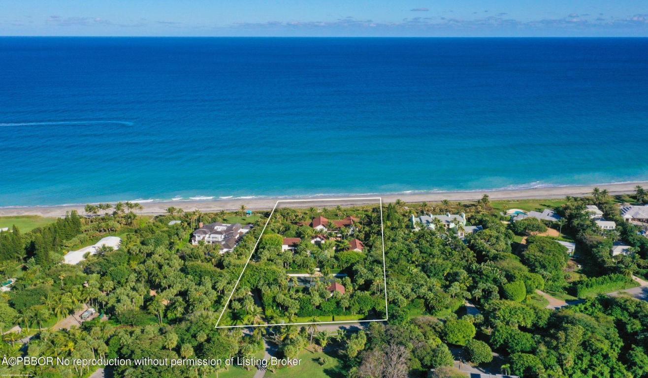 This magnificent Spanish Colonial style estate was designed by the renowned Alan Wanzenberg. With 265 feet of ocean frontage, this 3.3 acre site has it all! Built in 2008 of the highest quality, the property has a 5 bedroom main house plus 3 bedroom guest house. Other notable features include a full gym with sauna and steam rooms, caretaker apartment above storage garage, pool, Jacuzzi, and Har-Tru tennis court.
Offering complete privacy in the estate section of Jupiter Island.