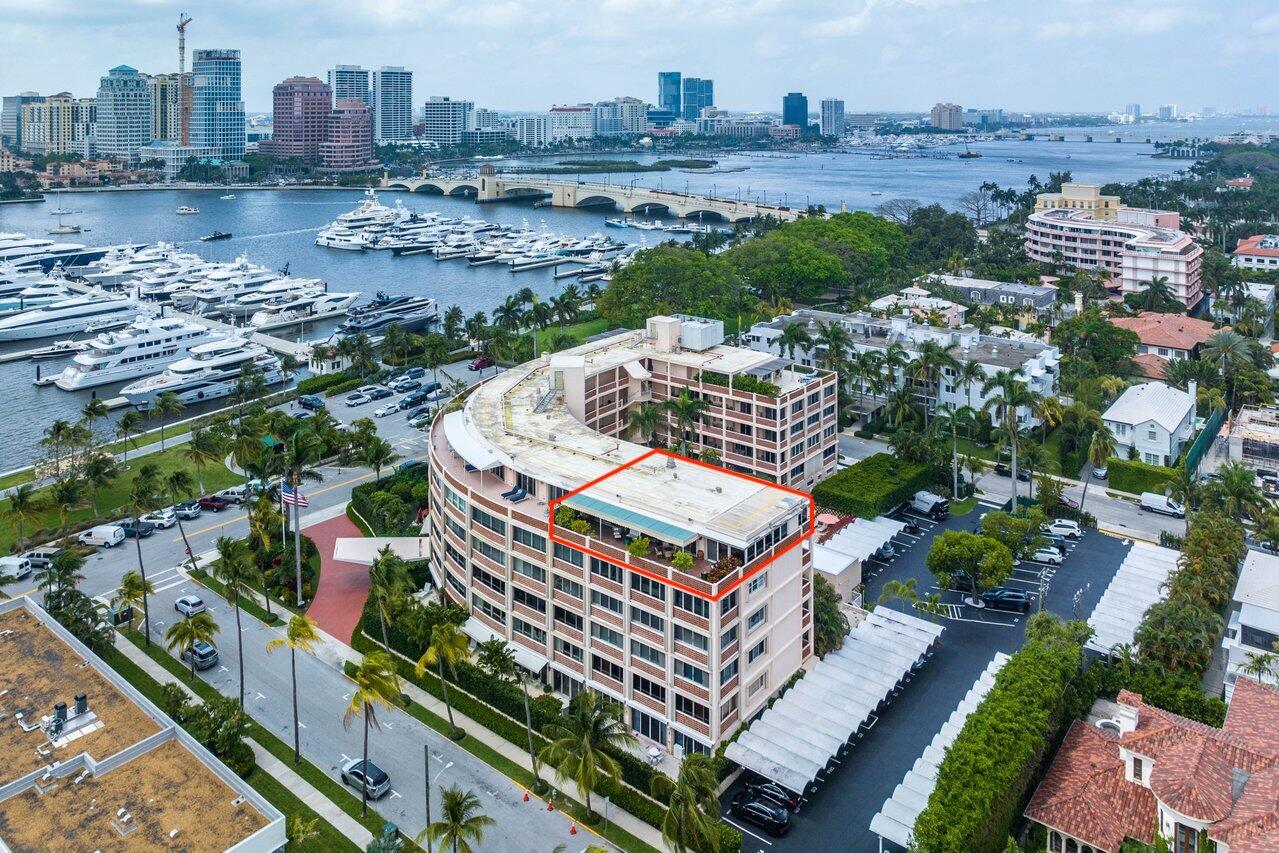 Looking for sunset views over Lake Worth on your own private 840 square foot penthouse terrace? Look no further than this spacious 2-bedroom, 2-bathroom penthouse at 369 South Lake. Just steps to Worth Avenue and the docks, this condo resides in the beloved Park Place, a 42-unit boutique co-op building in the heart of town. A truly unique condo-looking for a new owner for the first time in almost 30 years - a buyer looking to add their personal touch and modern-day designs. Washer and dryer in-unit. Park Place is a wonderfully managed building that is pet friendly (no size restriction on dog). A perfectly maintained community pool, a 24-hour doorman, plus a large staff and full-time property manager.One exterior parking spot included. Several recent updates have been made within the unit.