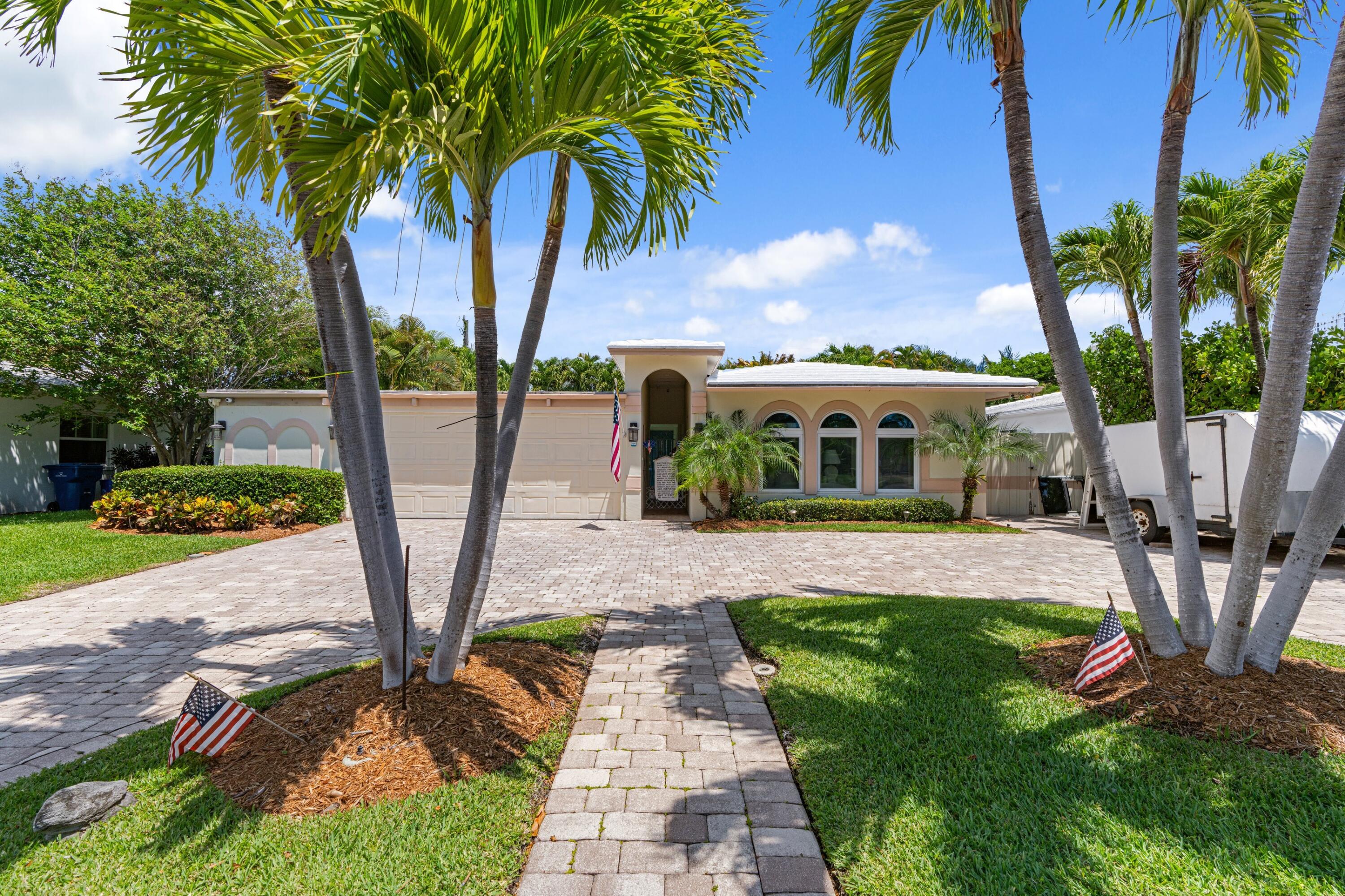 Walk to the beach!!  Only 1500 feet to the ocean.  Only 800 feet to the intracoastal waterway.  5-minute walk to Phil Foster Park with beach, 3 boat ramps, fishing pier.  Not only is there room for a boat, the 23-ft Chapparal Cuddy Cabin boat and trailer is included!!  There's a wood-burning fireplace with "Coquina" stone hearth, swimming pool, hot tub, and generator (with dedicated electrical breaker).  Full accordion shutters (and some Impact Windows).  New Carrier A/C (2-years).  Tankless hot water heater (4-years).  Huge 700 sq.ft. garage.  Large 360 sq.ft. primary suite with 2 walk-in closets, oversized shower and separate roman tub added 15-years ago.  Circular brick paver driveway.  Pergola covered patio.  First time on market in 30-years!!