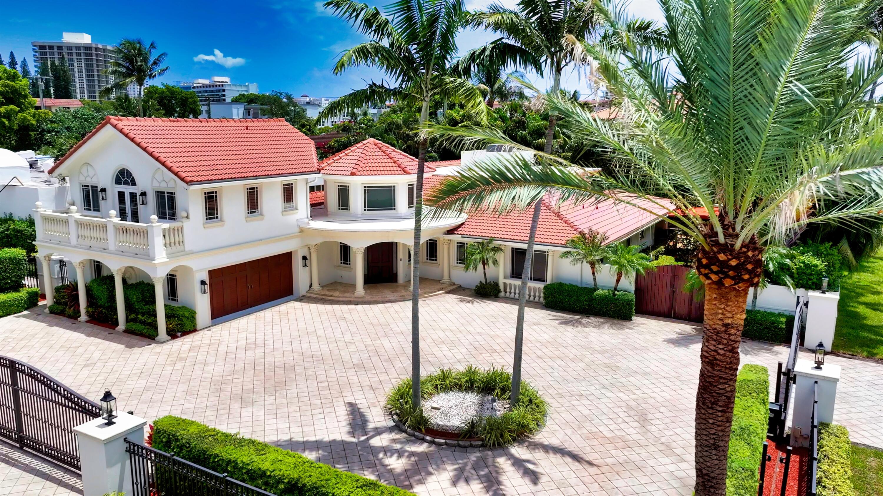 This corner estate-size lot is walled, gated, and privacy landscaped, with a multi-car motor court and side-load garage. An Astroturf side lawn, ideal for children at play, precedes the rear entertaining area, where the 30' x 15' sun-splashed saltwater pool with diamond brite finish and oversized spa are framed by a travertine deck. A poolside covered loggia includes a summer kitchen with sink, refrigerator, grilling station, and granite-topped bar.  First Floor: A dramatic two-story octagonal foyer leads through a column-framed archway into an airy great room. To the north, a gourmet chef's kitchen features counters and backsplash; an island with fridge, icemaker, storage and breakfast bar; Sub-Zero refrigerator, KitchenAid ovens, Miele dishwasher; white custom cabinetry and twin sinks. A butler's pantry with new countertop and a wine refrigerator; and a walk-in pantry. A library/office with vaulted ceiling enjoys French door garden access. The expansive secluded primary suite encompasses a luxurious double door marble bath with double vanity, Jacuzzi, shower, newly carpeted boutique custom walk-in closet, and private pool access. To the south are a VIP ensuite with private sitting room and a guest ensuite. A new laundry, a powder room, cabana half-bath, and garage complete the lower level.  Second Floor: Atop the back staircase, another VIP ensuite with vaulted ceiling has access to a front balcony with Intracoastal waterway view.  Special Features: new roof, refinished/stained front door, newly repainted (full exterior, 3/4 interior), volume ceilings, marble floors, plantation shutters, hurricane impact windows/doors, ethanol fireplace, nest AC system w/4 new units; new family room surround sound; new outdoor sound system; central vacuum; new whole-house water purification system; generator; hardwired multi-camera security; up-lit landscape; new backyard gate.    DISCLAIMER: Information published or otherwise provided by the listing company and its representatives including but not limited to prices, measurements, square footages, lot sizes, calculations, statistics, and videos are deemed reliable but are not guaranteed and are subject to errors, omissions or changes without notice. All such information should be independently verified by any prospective purchaser or seller. Parties should perform their own due diligence to verify such information prior to a sale or listing. Listing company expressly disclaims any warranty or representation regarding such information. Prices published are either list price, sold price, and/or last asking price. The listing company participates in the Multiple Listing Service and IDX. The properties published as listed and sold are not necessarily exclusive to listing company and may be listed or have sold with other members of the Multiple Listing Service. Transactions where listing company represented both buyers and sellers are calculated as two sales. "No payments made until title passes" Some affiliations may not be applicable to certain geographic areas. If your property is currently listed with another broker, please disregard any solicitation for services. Information published or otherwise provided by seller, listing company or its representatives is deemed reliable but are not guaranteed and subject to errors, omissions, or changes without notice. Copyright 2026 by the listing company. All Rights Reserved.