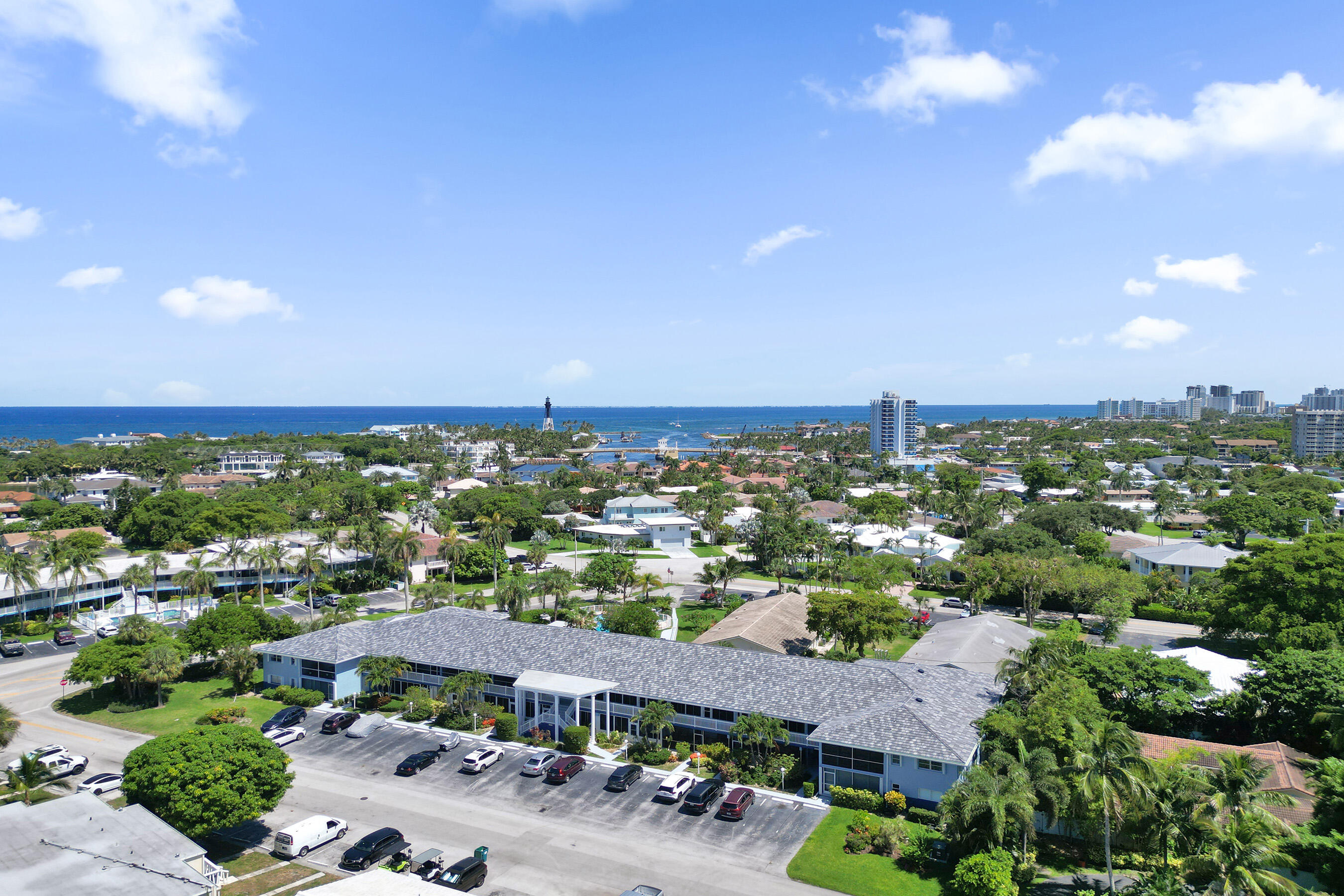 Sought-after Marina area of Lighthouse Point! Spacious 2nd-floor 2BR/2BA corner unit offering natural light and generous room sizes. Features include a 2025 A/C, updated kitchen & bath cabinets, hot water heater (2023), oversized bedrooms with custom closets, and a glass-enclosed patio ideal for a home office or den. Just steps to Nauti Dawg Marina for dining and boating. Enjoy a beautifully updated pool area, pet-friendly community (30 lbs), laundry room just outside unit, and tandem parking for two cars. pool has heater and chiller. Recent building improvements include new roof, concrete restoration, pool renovation, and AC tower motor, with new gutters, lighting, and freshly painted common areas underway. A must-see opportunity in a prime location!