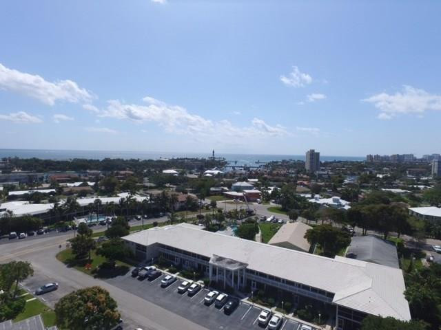 Sought-after Marina area of Lighthouse Point! Spacious 2nd-floor 2BR/2BA corner unit offering natural light and generous room sizes. Features include a 2025 A/C, updated kitchen & bath cabinets, hot water heater (2023), oversized bedrooms with custom closets, and a glass-enclosed patio ideal for a home office or den. Just steps to Nauti Dawg Marina for dining and boating. Enjoy a beautifully updated pool area, pet-friendly community (30 lbs), laundry room just outside unit, and tandem parking for two cars. pool has heater and chiller. Recent building improvements include new roof, concrete restoration, pool renovation, and AC tower motor, with new gutters, lighting, and freshly painted common areas underway. A must-see opportunity in a prime location!