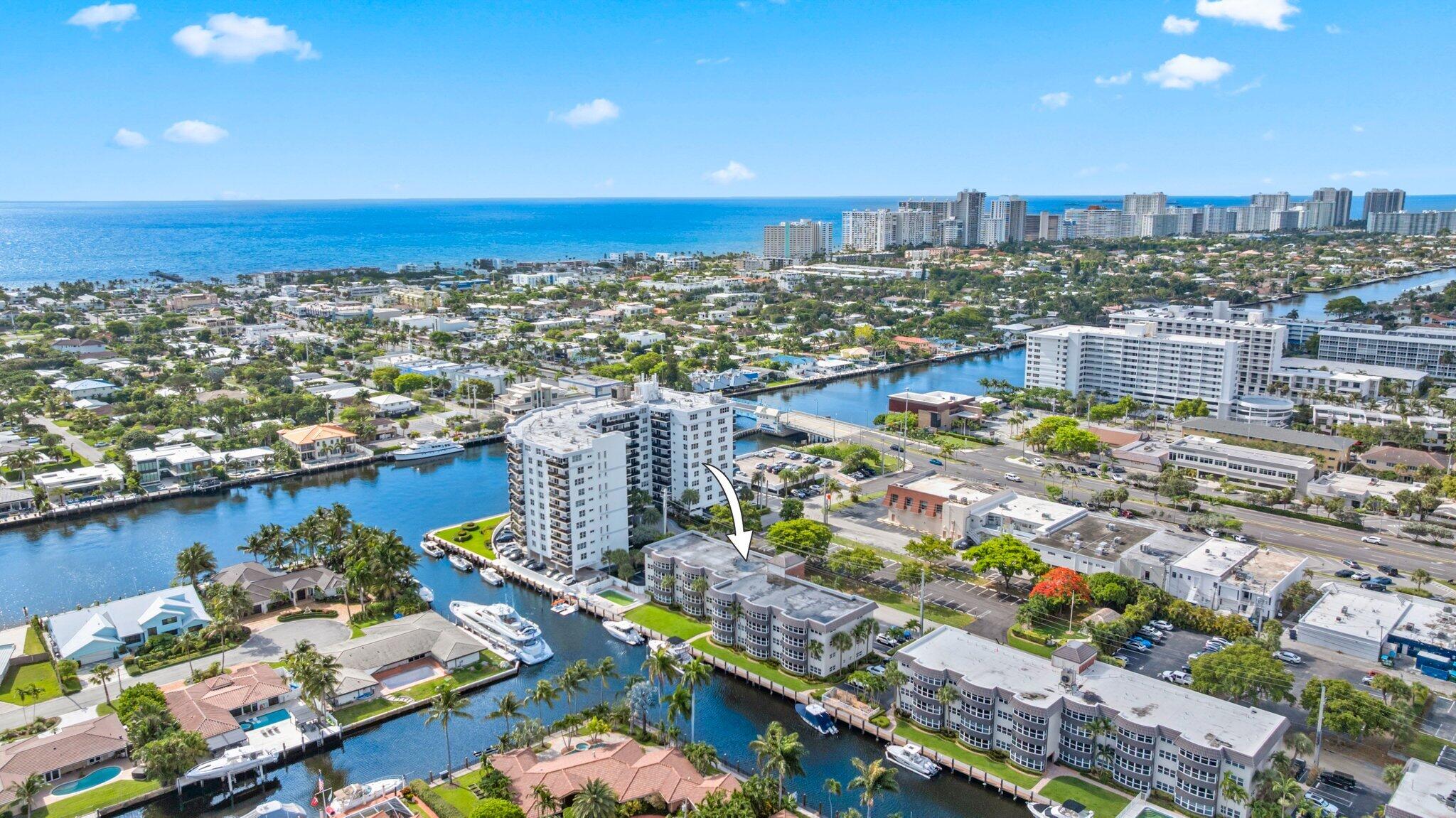 Boater's paradise awaits! This exceptional pet-friendly waterfront condo offers premium available dockage for vessels up to 50 feet with no fixed bridges to the ocean for just $10/ft a month. Highly investor friendly, you can rent right away. The open-concept residence is freshly painted and features rich wood floors, a modern granite kitchen, a newer A/C, a newer water heater, and an in-unit washer/dryer. Community amenities include a dedicated dog park and a waterside pool. Buyers will enjoy total peace of mind with fully funded building reserves, completed SIRS certification, and major upgrades including a new roof (2025), new elevators, dock, pool, and A/C water towers, ensuring excellent long-term value. Complete with a primary en-suite, this tropical gem sits minutes from the beach.
