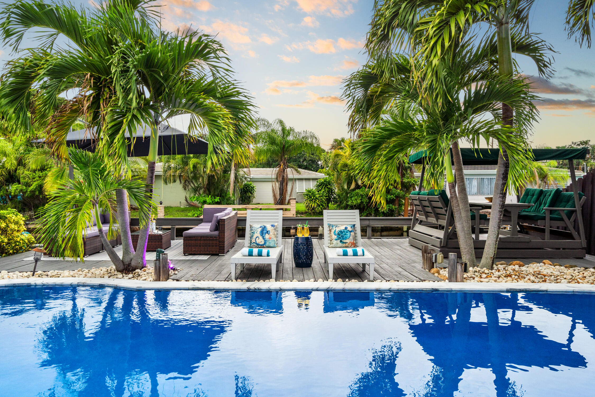 Comes fully furnished with management already in place, making this a true turnkey investment opportunity!! Welcome to your Island escape, a beautifully updated 4-bed/ 2-bath waterfront pool home designed for the ultimate South Florida lifestyle.  Interior features include: Impact windows, porcelain tile flooring, and a gourmet chef's kitchen with custom cabinetry, premium stainless steel appliances, a center island, and wine cooler, & 2 fully remodeled bathrooms,  Step outside to your private outdoor paradise, featuring a heated pool, fire pit, BBQ area, and plenty of space for entertaining. Enjoy kayaking or paddleboarding from your backyard canal, unwind in the game room, or simply watch the fish jump and manatees swim by.  Located just minutes from beautiful Fort Lauderdale & Pompano Beaches. Minutes from top-rated schools like Pine Crest, Cardinal Gibbons and Floranada Elementary.  With a proven track record as a successful short-term rental, this property offers exceptional investment potential or the perfect personal waterfront sanctuary.