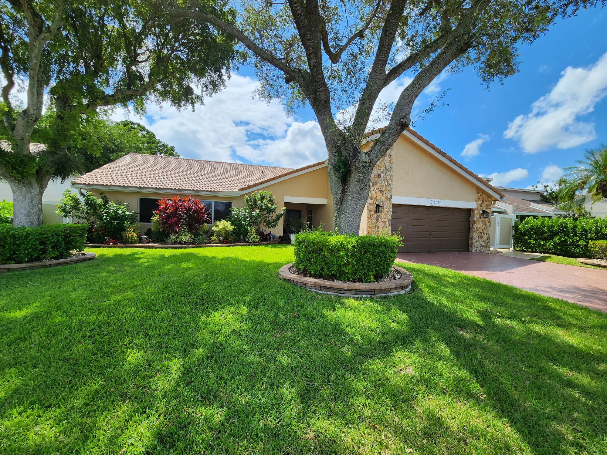 Turnkey Woodmont golf course oasis! This stunning 4BD (3 bed + flex/office) 2.5BA home offers ultimate peace of mind: 2024 Roof, 2022 A/C, and full impact windows/doors (incl. garage). Inside features vaulted wood-paneled ceilings, Mexican tile, custom built-ins with an electric fireplace, and an upgraded kitchen with newer appliances & a dedicated coffee bar.  Outside is a true zero-maintenance paradise! Enjoy a massive 900 SF screened patio, $200k+ in luxury upgrades including expansive travertine walkways, artificial turf, and a custom stone fire pit overlooking sweeping, unobstructed golf course views. Rare voluntary HOA without restrictive bylaws!