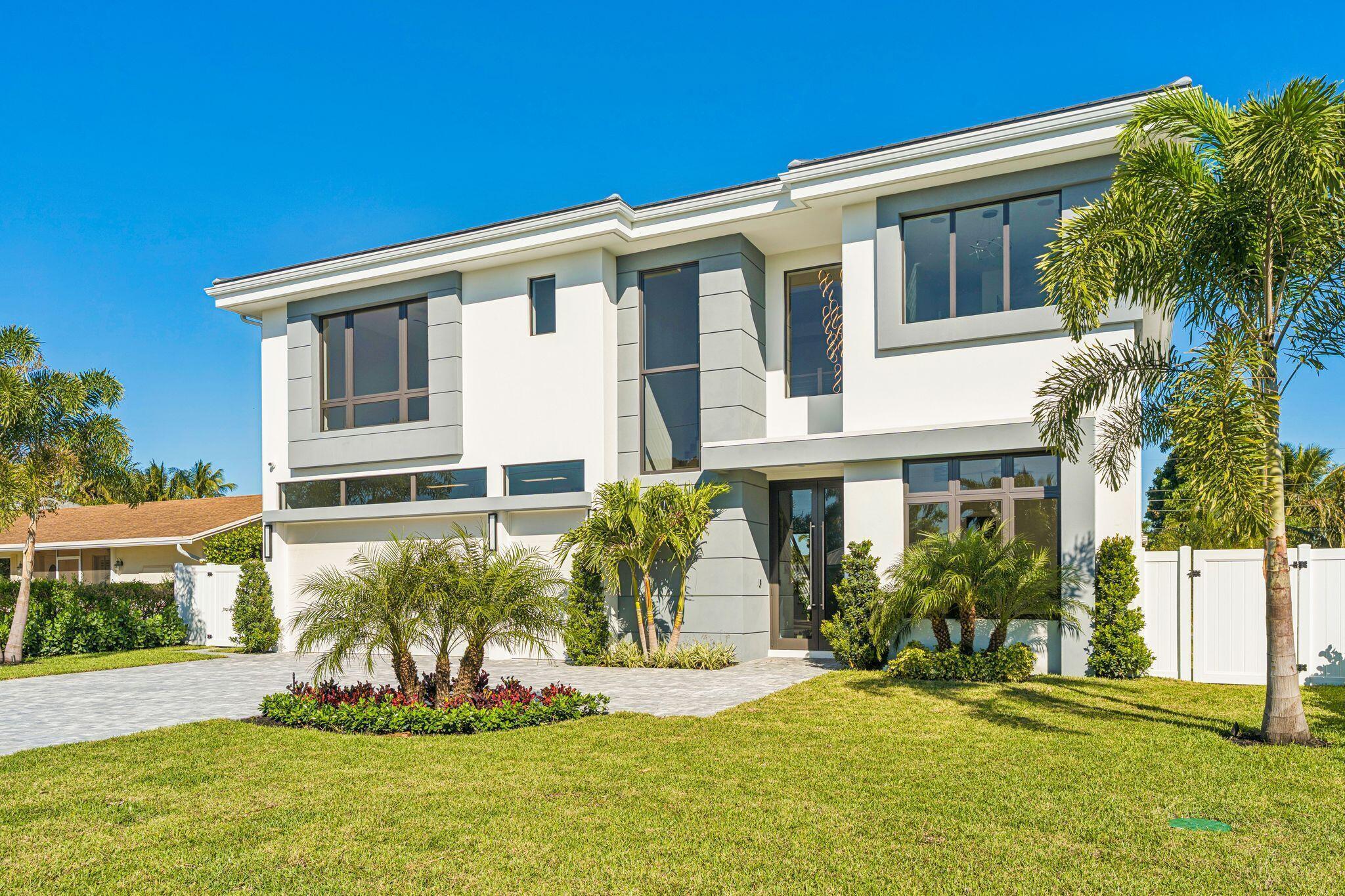 Imagine living just blocks from the action of Mizner Park and the Brightline, but coming home to a private sanctuary that feels miles away from the hustle. Freshly completed by Alpha Premium Development, this Spanish Village stunner is ready for its very first owner. Step inside to a wide-open floor plan designed for easy living. Whether you're working from the first-floor office or whipping up dinner in the gourmet kitchen (complete with a hidden butler's pantry!), the flow is seamless. The living space opens right up to a covered terrace and a sprawling backyard with a sparkling pool—perfect for al fresco dining, rain or shine. -- Upstairs, it's all about comfort. A spacious loft offers the perfect spot for a media room or play area. The Primary Suite is a true showstopper, spanning one whole side of the home with an "over-the-top" boutique closet you have to see to believe.  The best part? You finally have room for everything. With a massive laundry room and a rare 3.5-car garage, there's space for the SUV, the storage, and even a dedicated door for your golf cart. This is downtown Boca living without the compromise.