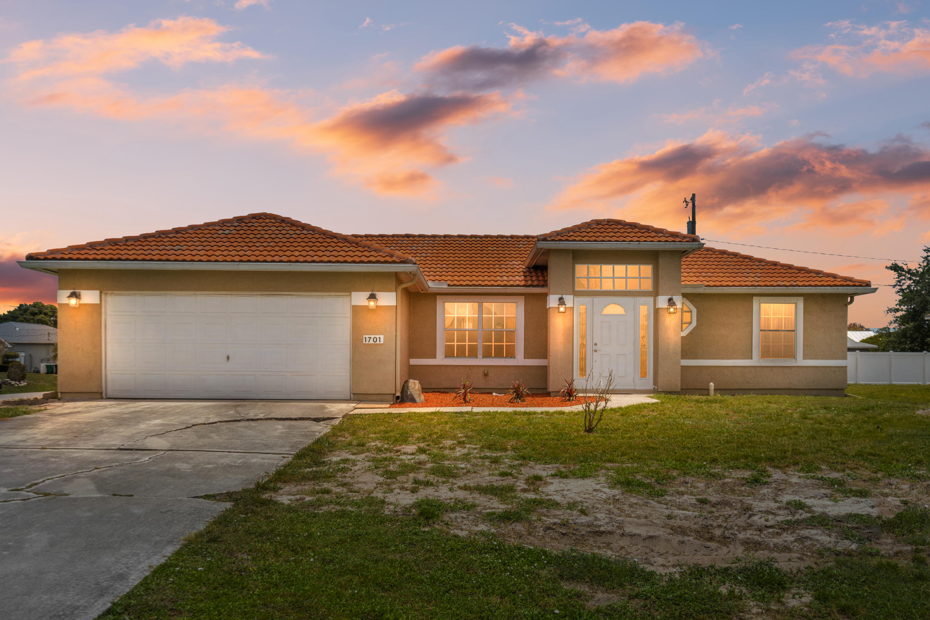 This 1358 sq ft. 3 bedroom, 2 bath home with a 2 car garage located on a spacious corner parcel. This is the one you have been looking for! Step inside to discover a bright and airy layout featuring vaulted ceilings, a desirable split bedroom design, and an inviting living area ideal for everyday living and entertaining.  Newer AC installed in 2018, water heater replaced in 2022, and a long-lasting tile roof from 2005. The bathrooms have also been tastefully refreshed. Out back enjoy a generously sized yard with mature fruit trees, full rain gutter system, and ample space to create your dream pool area. Perfectly positioned near dining, shopping, schools, and quick access to US-1, I-95, and the Florida Turnpike. Don't miss this opportunity call me today for additional details!