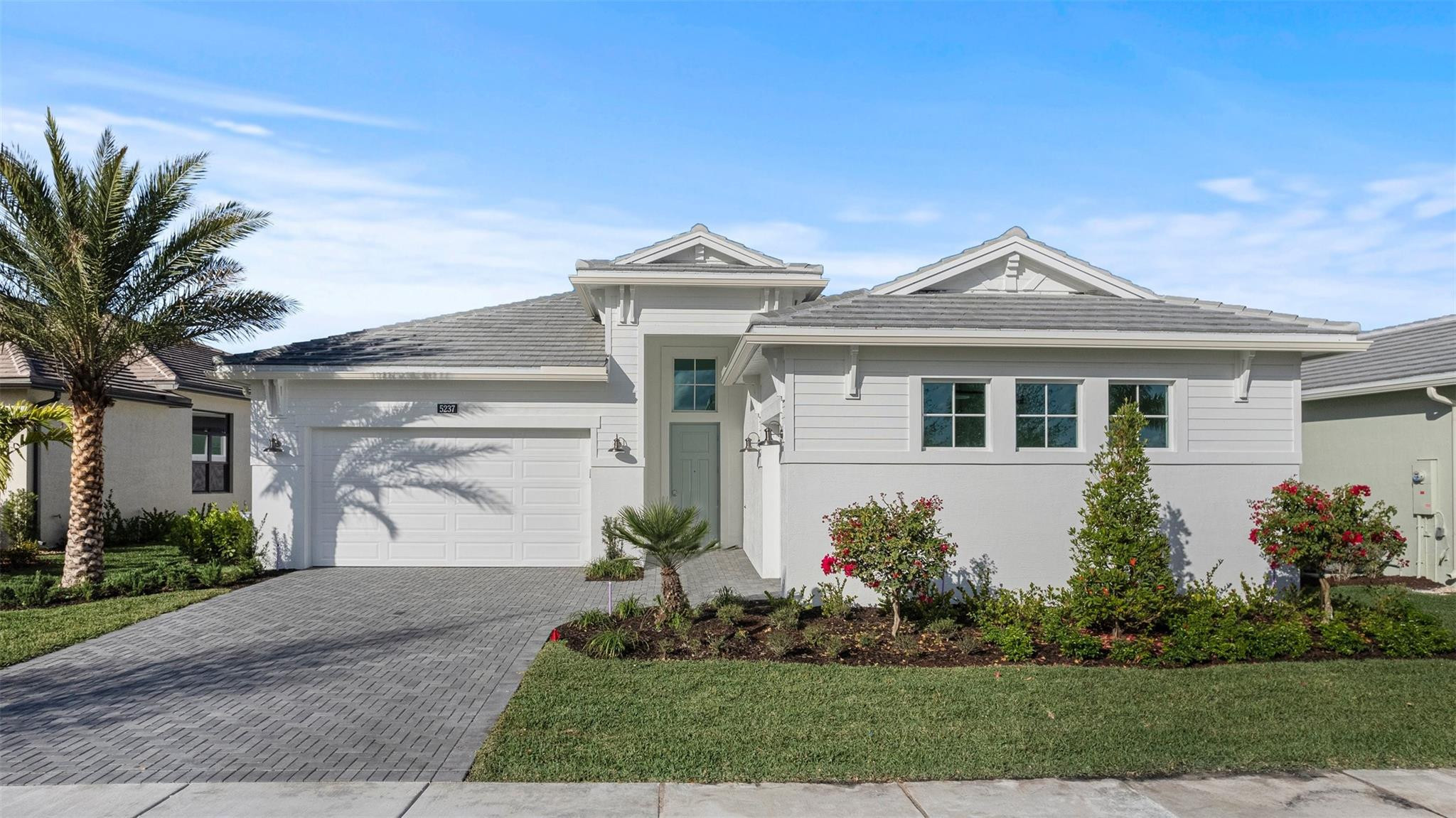 Move In Ready! Discover Cresswind Palm Beach, a premier 55+ community in Westlake, FL. Enjoy new, energy-efficient homes, an Adventure Park, dog park, and daily conveniences. Minutes from beaches, golf, arts, shopping, and dining. This exceptionally flexible and unique 3-Bedroom floorplan checks all the boxes. The split 2-Car and 1-Car Garages provide plenty of storage and hobby space. The large Island Kitchen welcomes entertainers and chefs alike. With expansive countertops and a large walk-in pantry, the Kitchen provides ample storage and prep space. The island overlooking the Great Room also allows entertainers to keep everyone engaged. The Flex Room off the Foyer is another dynamic space that can be used as a home office, fitness studio, craft room, or whatever you imagine.