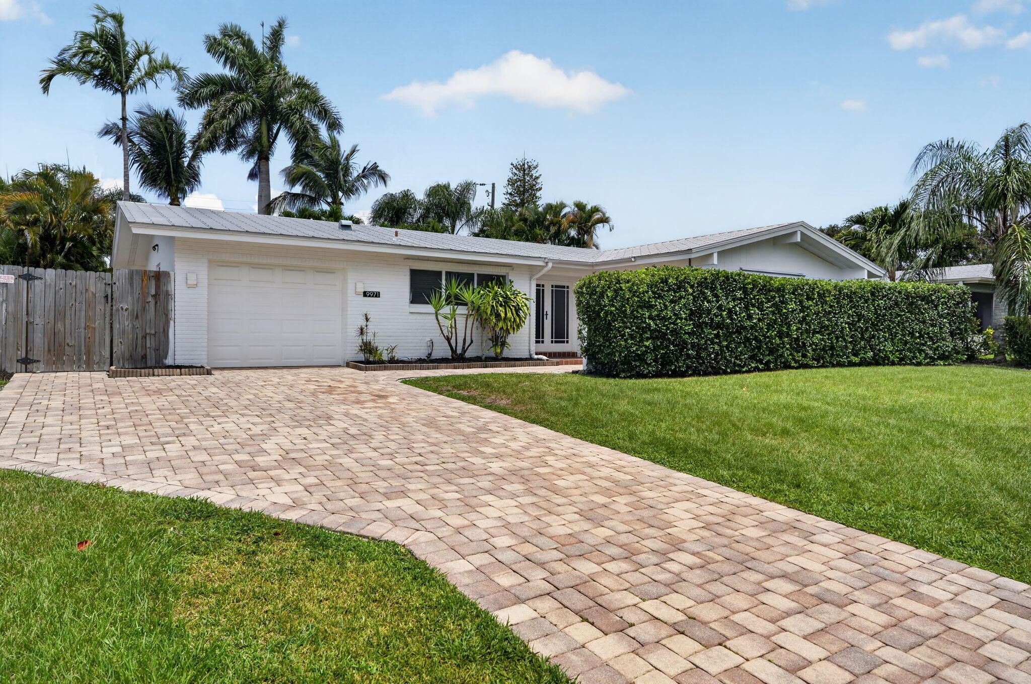 Step into effortless Florida living in this fully renovated Palm Beach Gardens residence. Bright, airy, and thoughtfully updated, the home offers an open-concept layout designed for both everyday comfort and easy entertaining. Natural light fills the living spaces, flowing into a stylish kitchen with sleek finishes and generous prep space.  The spacious primary suite provides a private retreat with ample closet space and a spa-like ensuite bath, while additional bedrooms offer flexibility for guests, a home office, or creative space. Outside, the lushly landscaped backyard creates a peaceful setting for relaxing or entertaining.  Minutes from dining, shopping at The Gardens Mall, and local amenities, this home blends modern comfort with timeless charm.