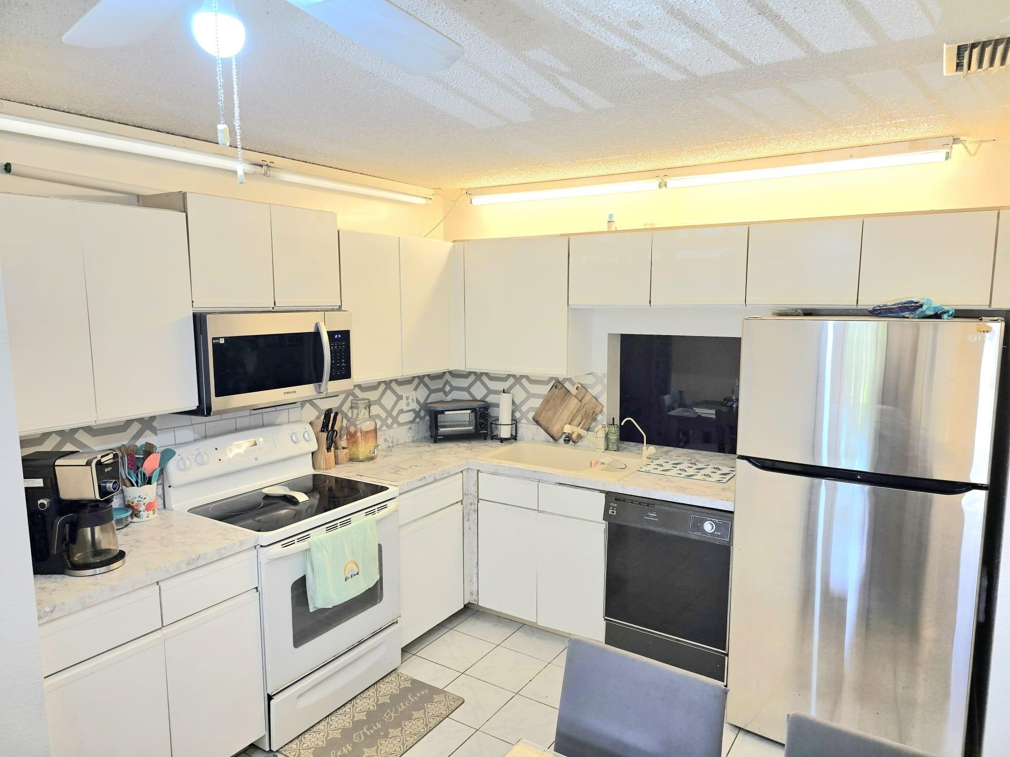 Beautiful well maintenance 2/2 unit 2nd Floor Water View, Laminated Wood Floor throughout with Tiles at the entrance, Bathrooms, Glass enclosed Patio, and Kitchen. The enclosed Patio has A/C for comfort on the hot days.  Crown Molding in the entire unit, Guest Bathroom Updated, Washer and Dryer in Unit, Water & Cable TV included. Active Community with Olympic Pool, Jacuzzi, Clubhouse, Sauna, Large Theater, Tennis Court, Gym, and much more. Located in the heart of Coconut Creek. All Ages Welcome.
