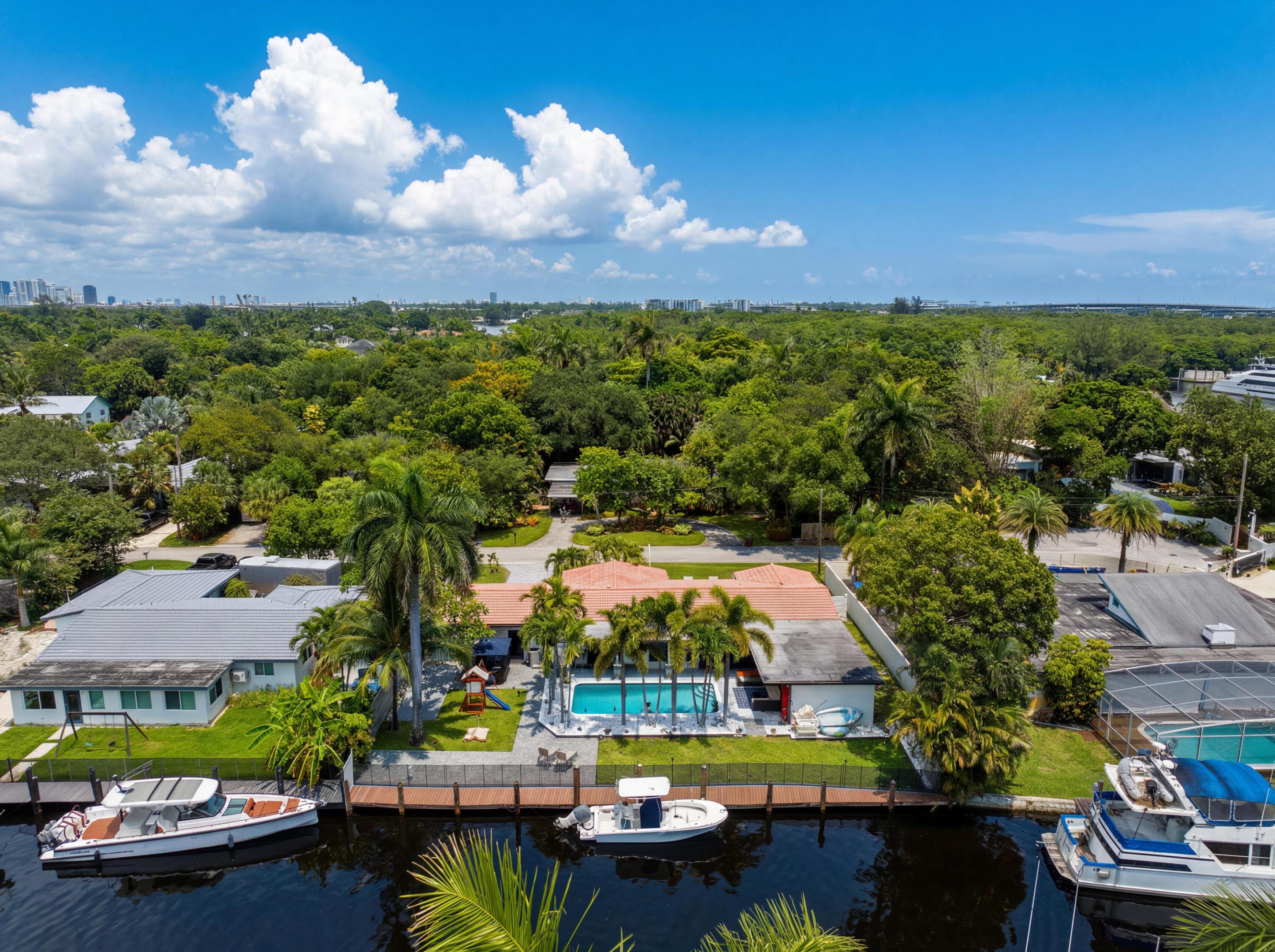 Rare opportunity in Riverland's most coveted pocket - this fully renovated waterfront home sits at the end of a quiet cul-de-sac just two doors from $6-10M estates, signaling exactly where this street is headed. Perched on one of the widest canals in the neighborhood, the property offers 100 feet of dockage with deep water, no-fixed-bridge ocean access - a boater's dream and increasingly rare find. The backyard is built for living: a deep heated pool anchors the outdoor space alongside a dedicated playground area for the kids. Completely gut renovated, this 4-bedroom, 3-bath home sits on a huge 13,000 sq ft lot with a 2-car garage and impact windows throughout. No HOA. No fixed bridges. No compromises. This is the kind of value-to-location play that doesn't last long in Riverland. Amazing wide canal view. Deep water. Ocean access. No fixed bridges. The house is at the end of a cul-de-sac in the boating neighborhood of Riverland. Private 100 foot dock.