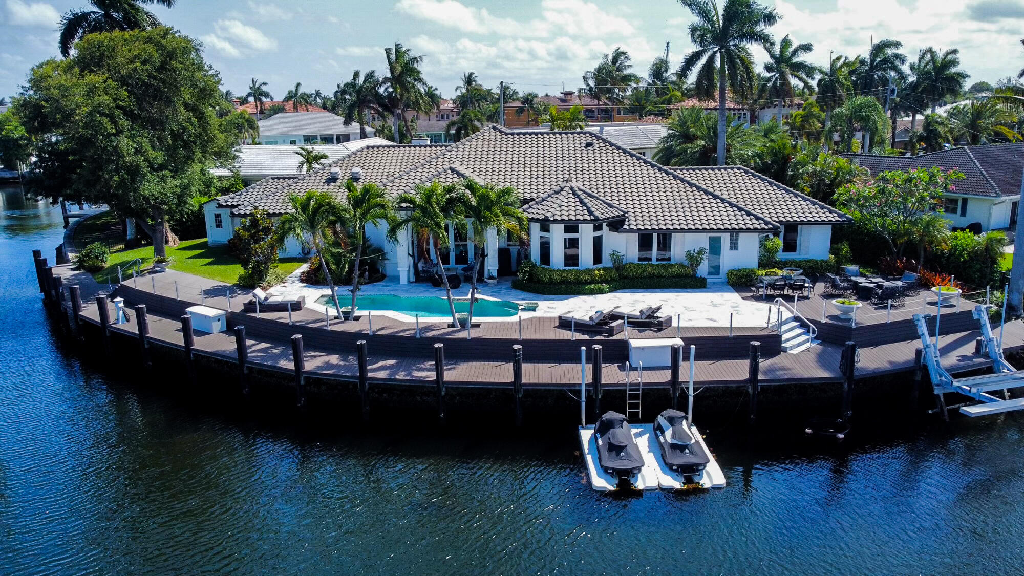 The Quintessential Estate for the Yachting Enthusiast sited on a Premier Point Lot with over 200' of waterfrontage on the Cap Knight Bayou Canal!  2521 NE 34th Court is a Stunning Totally Renovated Waterfront Estate that Accommodates a large yacht and Boasts Amenities designed for the Discerning Boater including a Boat house, ample Power at the dock, and a state-of-the-art Trex Dock System.  This Exceptional Property features a Resort-Style Pool w/ Beautifully Landscaped Grounds, an Outdoor, Covered Dining Space, 4 bedrooms, 4 full baths, & a Luxurious Master Suite. Located on a quiet cul-de-sac, this Residence presents the Ultimate for those Looking to Capture South Florida's Best Waterfront Lifestyle.