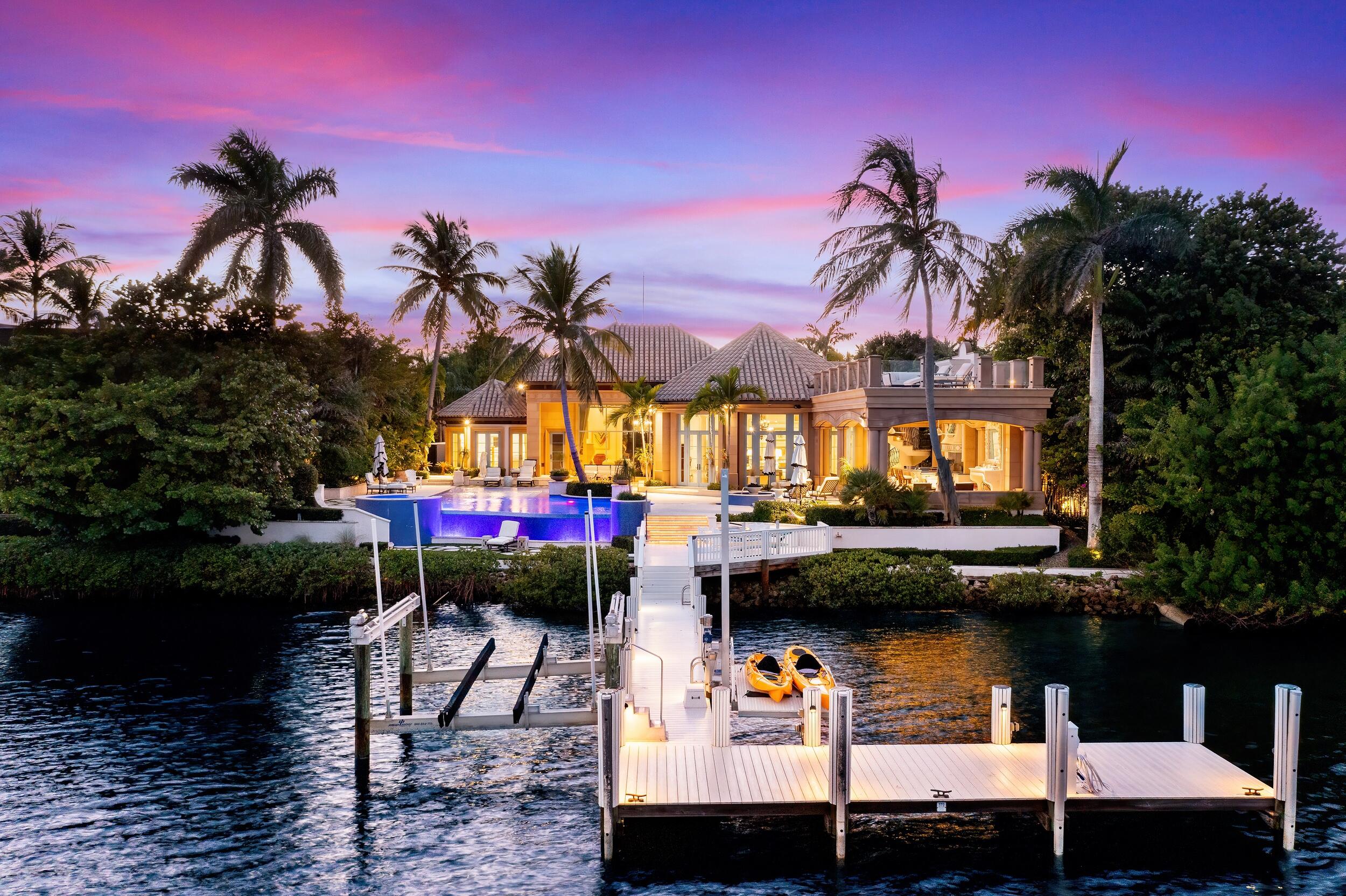 Nestled quietly among the supreme privacy of Jupiter's coveted Admiral's Cove sits 372 Regatta Drive, a palatial estate so unique you may never see its like again. From the immaculately landscaped entrance drive to the grand foyer, 6-car garage, extended guest house and 115 feet of waterfront, no expense was spared in creating this masterpiece exhibiting extensive use of exceedingly rare stone & wood craftsmanship across over 10,000 sq. ft. of living space. Among its 6 full beds/baths, the master suite features his/hers baths & closets, a morning bar & Intracoastal views. The guest house is complete with laundry & kitchenette. Surrounded by world-famous beaches & boating, Admiral's Cove is among the most private marina, golf & country clubs in the U.S., providing a true luxury experience.