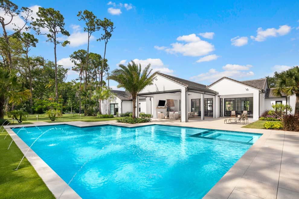 Exquisite new contemporary estate beautifully situated on 1.46 acres is the perfect oasis for tranquility and sophistication. Designed by renowned architect Randall Stofft, this expansive estate offers extraordinary outdoor space; large pool & spa; magnificent, covered loggia and summer kitchen; stunning floor to ceiling windows; gourmet kitchen; spacious primary suite with dual closets; and four car air-conditioned garage. No expense was spared on this custom residence boasting marble, wood and porcelain finishes; custom cabinetry and woodwork; Lutron lighting and Sonos system; hurricane retractable screens for covered loggia, and more. Set in the Village of Golf, Florida's hidden gem...exclusive, gated and home to the Country Club of Florida, one of Florida's premier private clubs " T & T Homes builder
" Randall Stofft Architects design
" Carter & Associates Landscape Architect & Design
" Provenza Wood Flooring
" Tongue & Grove Ceilings Throughout Interior & Exterior
" Custom Made Cabinets & Vanities
" 10' From Floor, Aluminum Doors, Windows & Sliding Doors
" Large Pool with Fountains, Spa and Sunshelf
" Porcelain Pavers Back Patio
" Hurricane Roll Down Screens on Back Patio
" Linear Air Vents 
" Lutron Lighting System
" Sonos System Throughout
" Porcelain & Marble Counter Tops Throughout
" Wolfe & Sub-Zero Appliances
" Coffee Bar 
" All Door & Window Alarm System with Motion
" Ring Security Cameras and Doorbell
" Separate Monitored Security Cameras
" Fully Fenced Side and Rear Yard
" Insulated Garage Doors
" Fully Insulated 4 Car Garage
" Fully Air-Conditioned Garage
" Speakers & A/V Hookups in Garage
" Fully Automated Generator Generac
" Vent Free 42" Gas Fireplace
" Seamless Gutters 
" All Downspouts Routed Away from House Underground
" Full Exterior Wi-Fi coverage
" Electric Outlets Added Throughout the Yard
" Shower Enclosures in all Bathrooms
" Extra Large Putting Green
" Spray Foam Open Cell Insulation Throughout, Including 
        Garage
" All Concrete Block Filled with Insulation
" All Interior Walls Have Insulation for Sound Control
" 70' Well & Pump for Irrigation
" Porcelain Pavers Motor Court
" Porcelain Pavers Driveway Apron
" Gas 48" Range Wolfe
" 2 Gas Navien Exterior Hot Water Heaters with Recirculating 
        Pumps
" 4 Air Conditioners 
" Exterior Front and Rear Yard Lighting
" Back Yard Speakers and Subwoofers
" Shell Stone Driveway with Border
" Walk in Closets with Built-ins Throughout
" Engineered Cladding on Some Exterior Walls
" LED Lighting Throughout