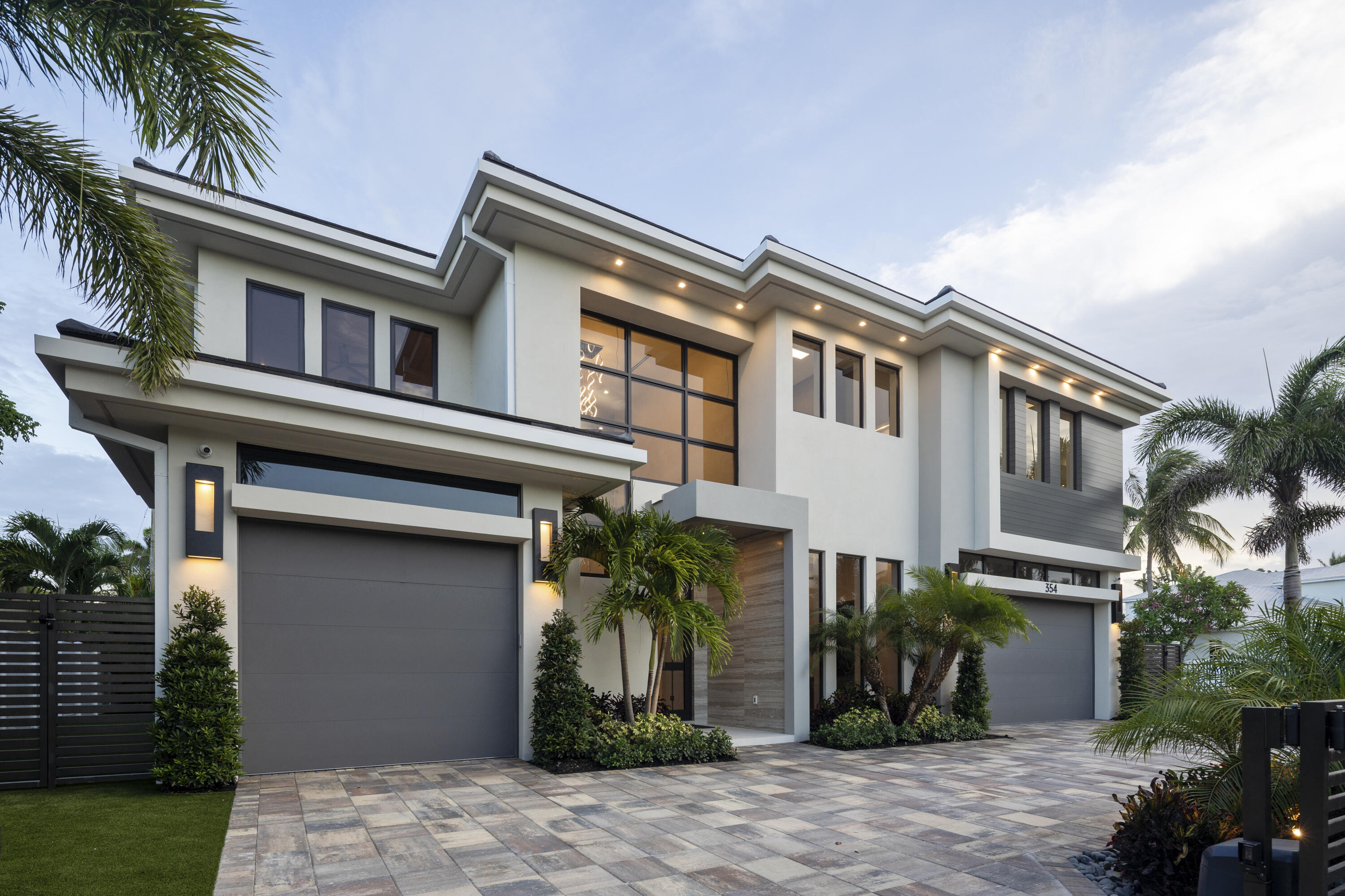 This isn't just another home in Boca Villas—this is the one. Forget the comparisons. This home doesn't play by the rules—it sets them. It's your personal sanctuary, your private escape, and your ultimate stage for unforgettable entertaining. From the moment you walk in, you're hit with that rare feeling: calm confidence, a spontaneous smile, and a jolt of ''I've finally found it.''
Born from bold vision and crafted to impress, this modern masterpiece blends laid-back luxury with grand, open-concept living. Sun-soaked spaces invite the outdoors in, yet still feel cozy enough for a quiet movie night in fuzzy socks and candlelight. Designed for everyone, yet perfect for just you, the home offers five ensuite bedrooms—including a guest suite on the first floor—along with a stylish home office and a club room that flexes for any occasion.
The chef's kitchen is truly next-level, outfitted with full-size Wolf and Sub-Zero appliances, and backed by a full scullery with a second full setup. Whether it's holiday feasts, Sunday brunch, impromptu dinner parties, or even your debut on the Food Network, this kitchen is built for it all.
Upstairs, the magic continues. Take the stairs or your private elevator to the second-floor loft, a cozy social space perfect for game nights, binge-watching your latest obsession, or just unwinding. Each of the four upstairs bedrooms features its own private bath and walk-in closet. And the primary suite? A sanctuary within a sanctuary, complete with two walk-in closets, custom built-ins, and a spa-style bath that brings serenity to a whole new level.
Then there's the real showstopper: the backyard. Slide open the doors and step into your private outdoor oasis. Fire up the Wolf grill in the summer kitchen, mix drinks at the bar, catch the game on the waterproof SunBrite TV, or take a twilight dip in the saltwater pool before winding down in the spa. Whether it's a quiet alfresco dinner or an all-out celebration, this space was made for making memories.
Location? It doesn't get better. Just two blocks from Mizner Park, you're steps from everything restaurants, bars, bowling, movies, coffee shops, concerts, nightlife, and more.
And yes, the home is fully loaded. Automatic window shades, a full-house generator, built-in speakers in every room, TVs already installed (inside and out), a Control4 smart lighting system, commercial-grade WiFi, security cameras, an automatic gate, and wireless pool controls all managed effortlessly from your phone, no matter where you are in the world.
This isn't just a house. It's a lifestyle. A vibe. A once-in-a-lifetime kind of home for someone who wants it all and then some.