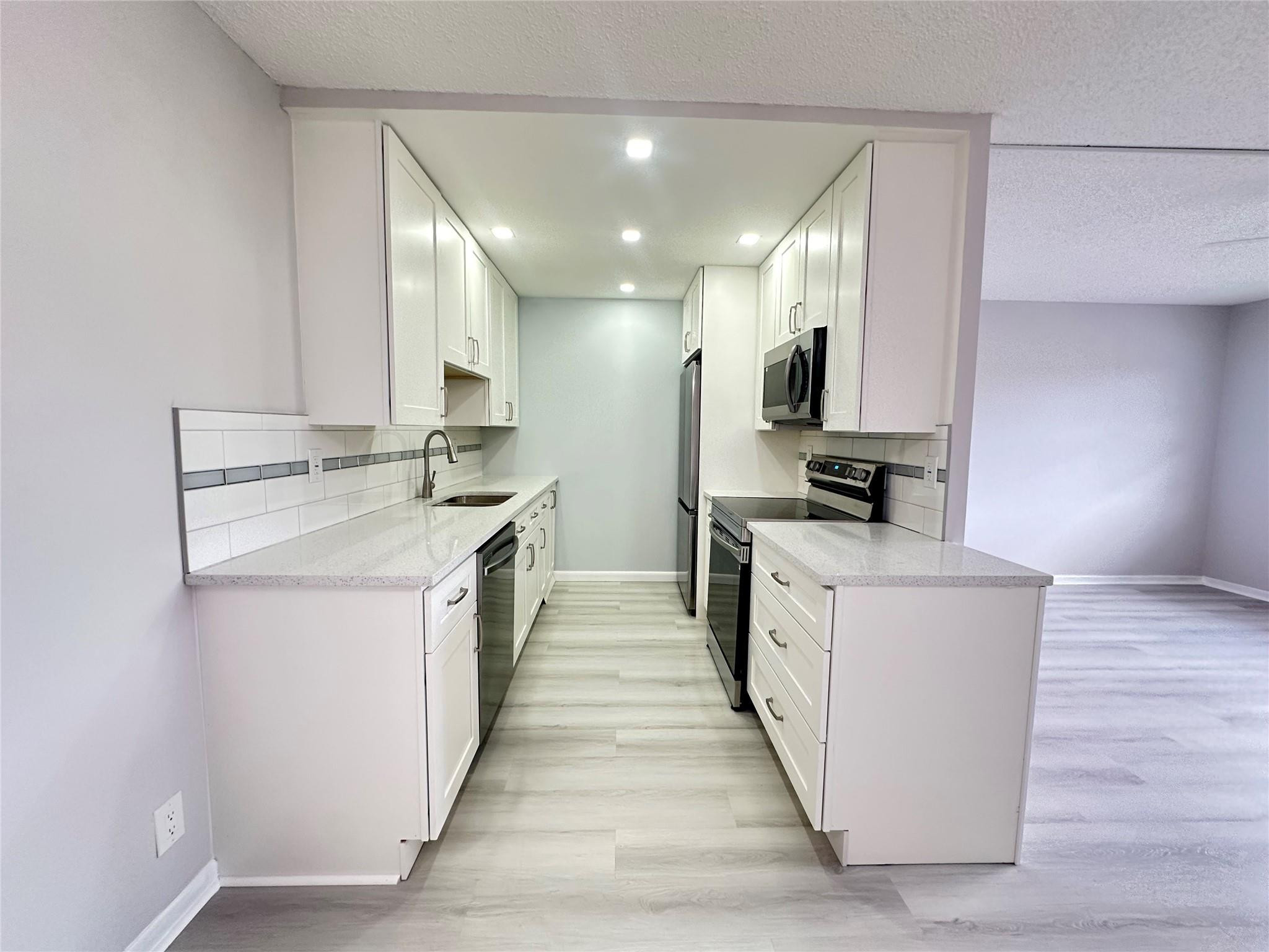 Fully remodeled WATER VIEW, 1 bedroom, 1.5 bath, 2nd floor condo. Located in active adult community in the heart of Deerfield Beach. Walk to pool & tennis. Kitchen features stainless steel appliances, recessed lighting, white shaker cabinets, subway tile & double sink. New electrical panel. Luxury vinyl flooring, screened patio with ceramic tile and extra storage. HWH - 2019, AC - 2020. Community BBQ area for building residents. CVE offers resort style  amenities galore including a lavish clubhouse, 1,500 seat theater, premier performances, shuttle buses, state of the art gym, pickleball, putting greens, tennis, indoor & outdoor pools, movies, classes of every type and more! Close to shopping, restaurants & beach.  Non-rental. Assoc claims 55+