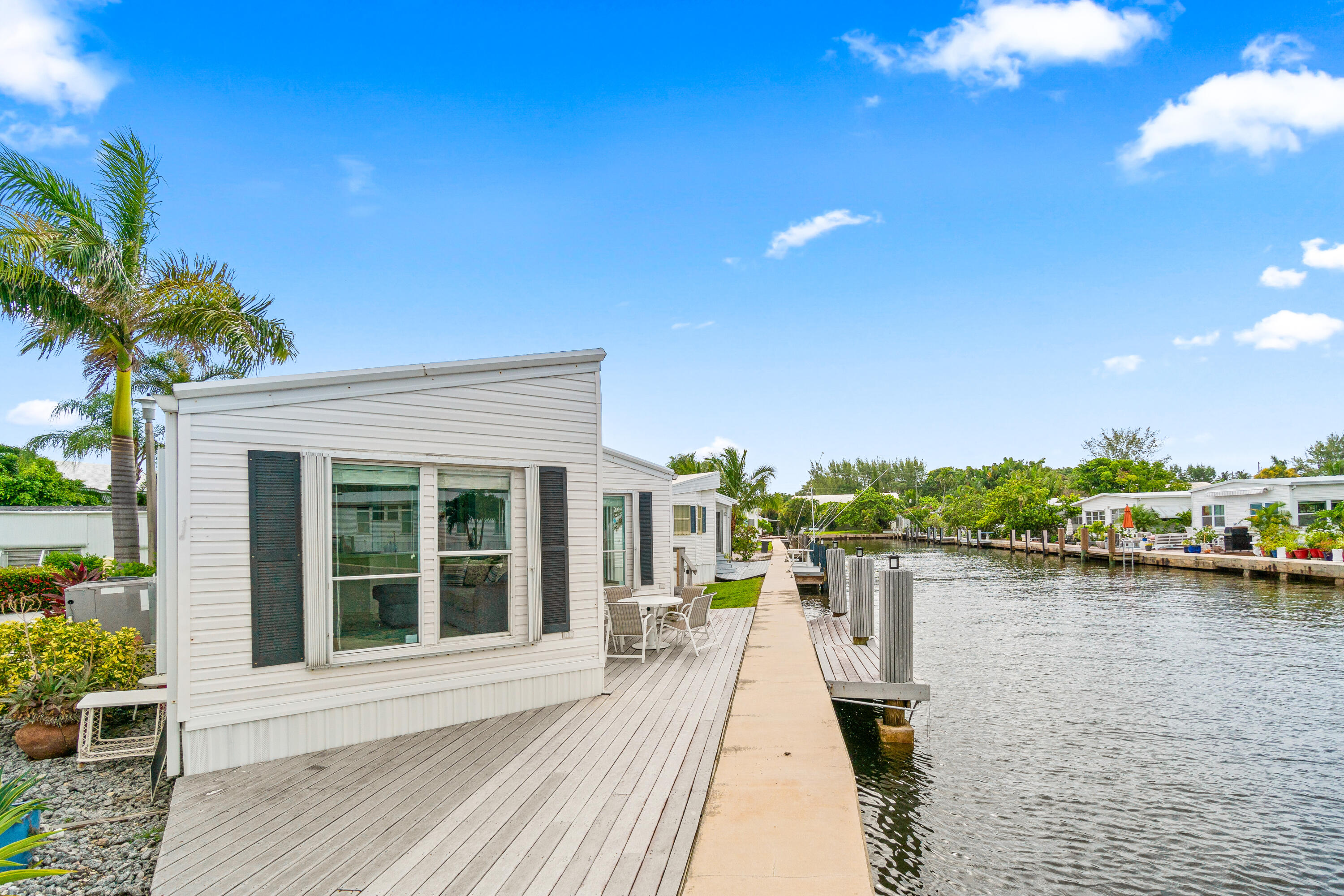 Offered for sale with 46 shares in the Briny Breezes Cooperative, this spacious 2-bedroom, 2-bath home offers panoramic water views from nearly every angle. Nestled in one of the most coveted locations in the community, this unit combines comfort and coastal charm with generous interior living space, perfect for year-round living or a seasonal retreat. Don't miss your chance to experience the Briny lifestyle—complete with private beach access and resort-style amenities. Schedule your private showing today!