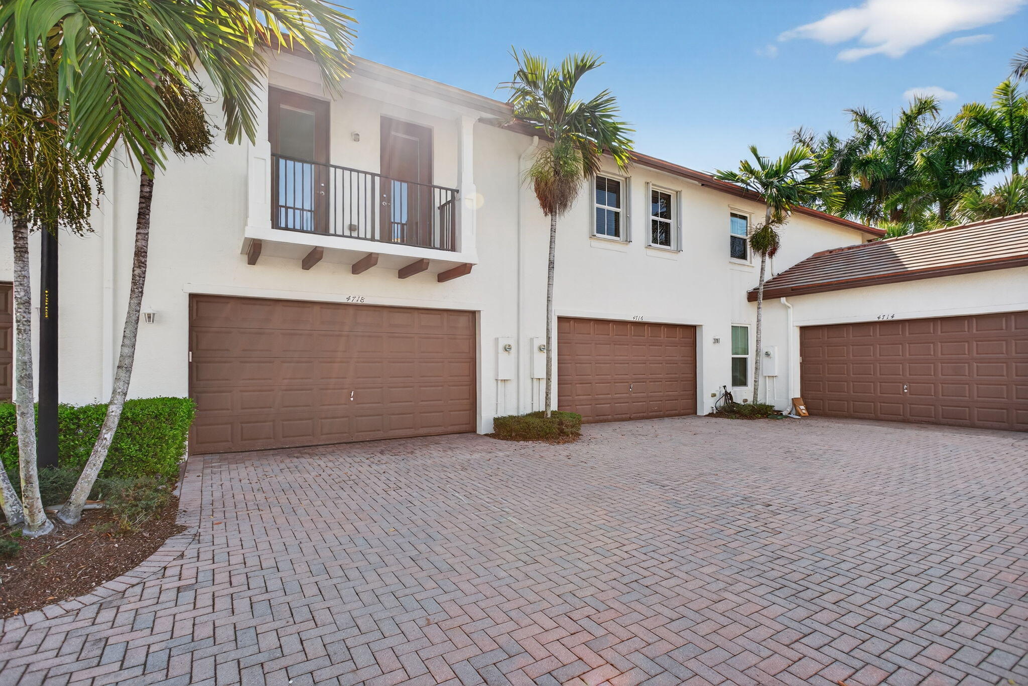 Stunning lakefront townhome in Paloma Lakes, Coconut Creek's premier gated community. Enjoy lake and fountain views from your private balcony, an open-concept layout, and an updated kitchen with white shaker cabinets, granite countertops, and stainless appliances. The primary suite features a tray ceiling, walk-in closet, balcony access, and spa-inspired ensuite, plus two additional bedrooms and upstairs laundry.  Low HOA includes internet, exterior insurance, resort pool, and walking trails. Walk to The Promenade's 30+ shops and restaurants and top-rated Monarch High School. Gated, pet-friendly, all ages welcome.
