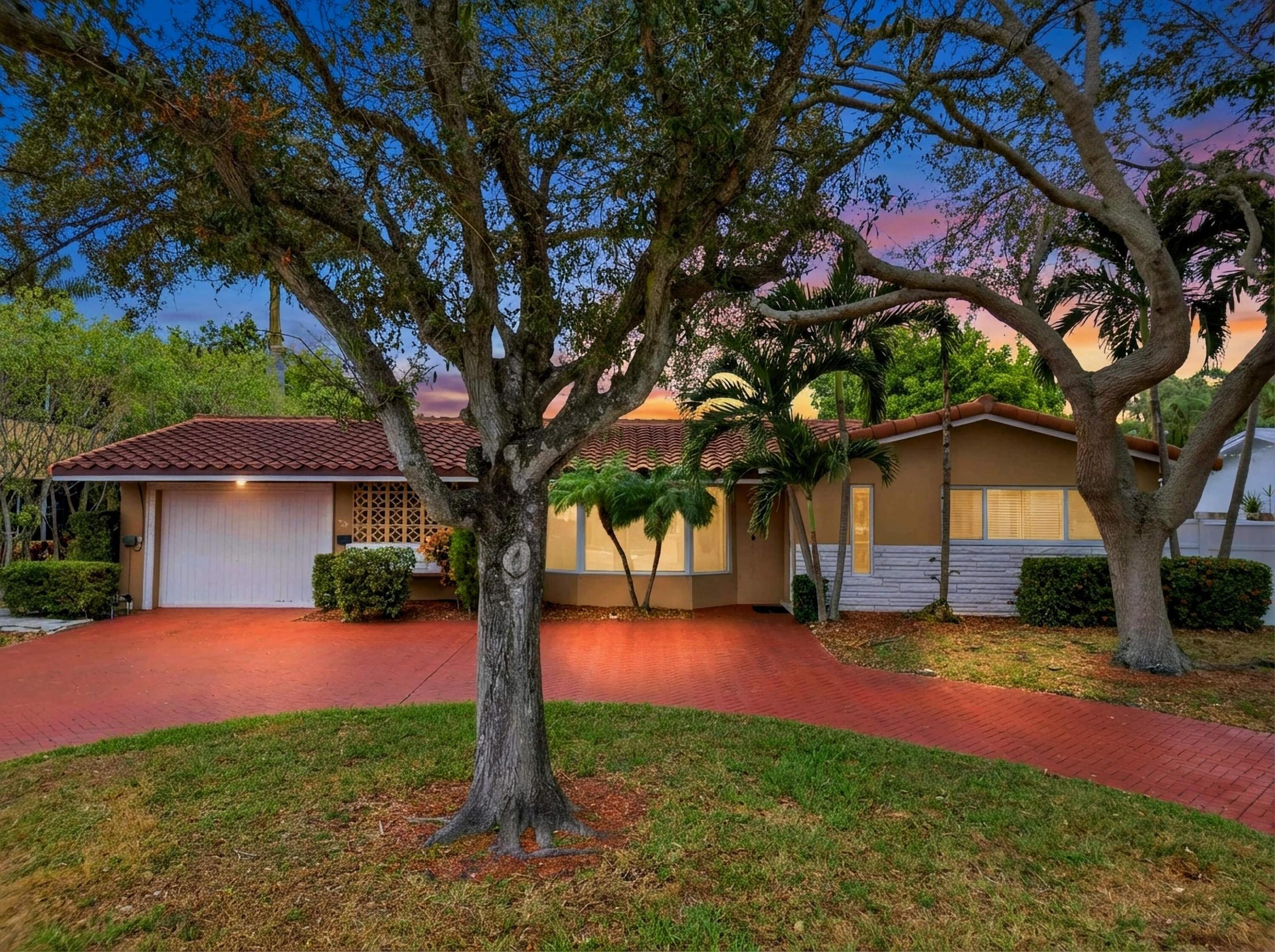 Fantastic opportunity to rent this spacious 3-bedroom, 2-bathroom renovated home, available furnished or unfurnished. Featuring brand-new flooring throughout, the home offers a fresh, modern feel. Enjoy a circular driveway and a large, private backyard ideal for entertaining, with a beautiful gazebo and an expansive enclosed patio. The fully fenced yard is beautifully landscaped with tropical plants, creating a serene, resort-style setting. Located on a picturesque, tree-lined street in the heart of Lighthouse Point, just a few streets from DeGroff Park and close to the Lighthouse Point Marina and the popular Nauti Dawg restaurant. Known for its quiet, family-friendly atmosphere, Lighthouse Point features approximately 18 miles of navigable waterways with easy access to the Intracoastal and the Atlantic-ideal for boating and water enthusiasts. Residents enjoy scenic parks, tennis, fishing, community events, and the Lighthouse Point Yacht Club, all while being minutes from beautiful beaches, dining, shopping, and major South Florida amenities.  Enjoy relaxed coastal living in one of Lighthouse Point's most desirable neighborhoods!