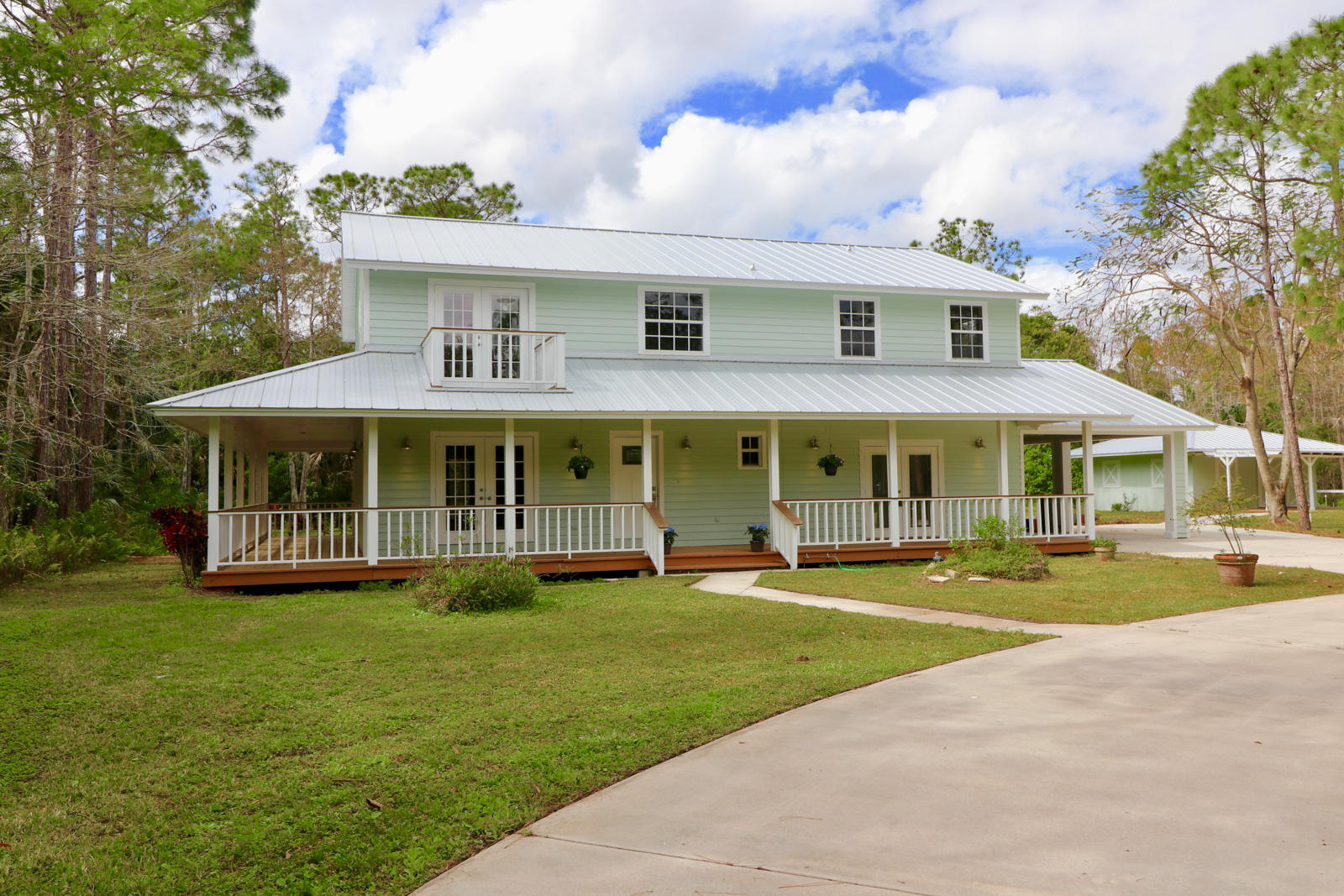 Welcome to this charming 3-bedroom, 2.5-bathroom residence in Jupiter Farms, offering 2,324 square feet of finished living space across two stories. This single-family home is situated in a community that welcomes horses, making it an excellent choice for equestrian enthusiasts and those seeking a rural lifestyle. The thoughtful floor plan provides ample space for comfortable living, with well-proportioned rooms designed for everyday enjoyment. Located in Jupiter Farms, Florida, this property offers the appeal of a pastoral setting while maintaining convenient access to area amenities. Discover the possibilities this home presents for your next chapter. Separate building can be used as in-law suite or separate rental.  Two stalls in additional structure.