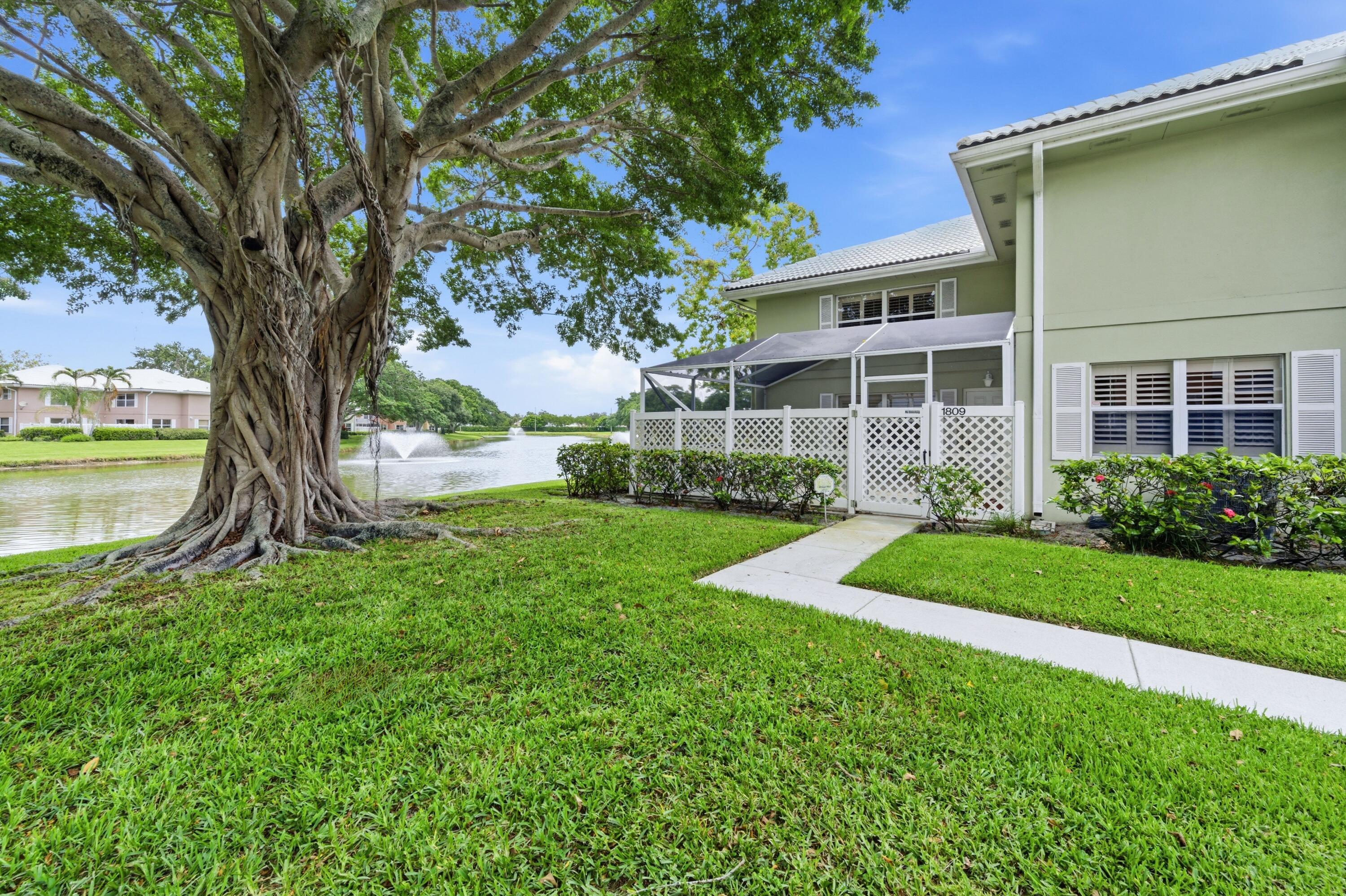 Welcome to this lovingly cared for waterfront townhome centrally located in West Palm Beach. This unit is situated perfectly in the community with wonderful lake and fountain views from your living room and screened in patio with perfect northwest exposure for relaxing in the courtyard.  Original owner has maintained this unit wonderfully over the years, But now its time for someone new to make it theirs. Partially updated kitchen with newer stainless steel appliances.  The main living area is tiled throughout. A large living room is perfect for entertaining or relaxing. The first floor also offers a formal dining area, half bathroom, and laundry room with washer and dryer.  The second floor you will find the primary suite with a very large walk-in closet and primary ensuite bathroom. The second bedroom upstairs also offers an ensuite bathroom and very large wall length closet with sliding doors and plenty of storage.  Both upstairs bedrooms offer lake views.  This community offers affordable townhomes in an amazing location in the heart of the villages in West Palm Beach. The low monthly HOA fee covers your building insurance AND roof maintenance with no current assessments. Enjoy access to community pools, tennis courts, and many other amenities. This location is 10 minutes to downtown West Palm Beach, The Palm Beach Outlets, and the Ball Park of the Palm Beaches. Located less than 15 minutes to the beach, easy access to I-95, Florida's turnpike, and Palm Beach International Airport.