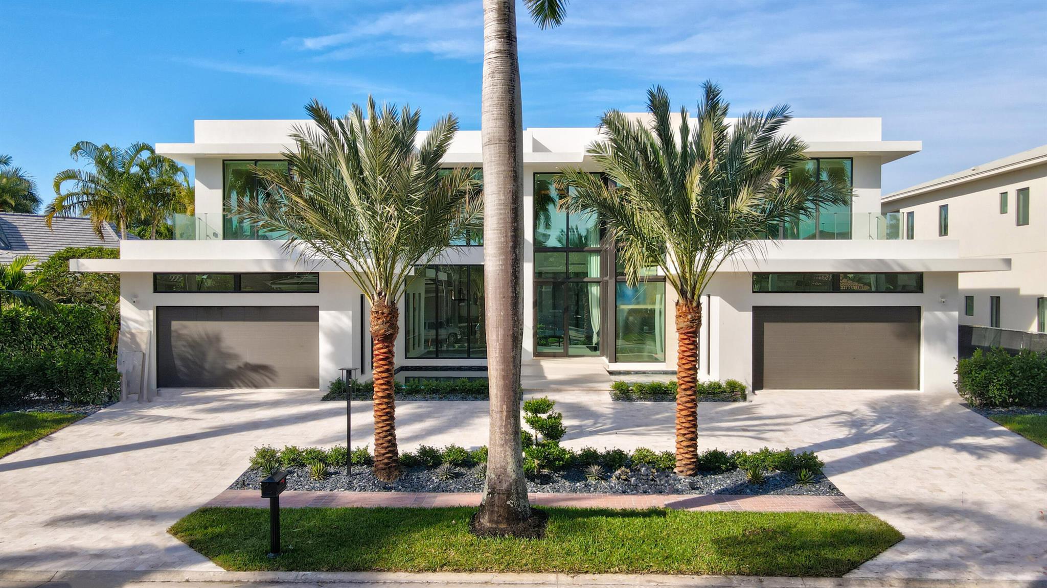 Reich Construction Group continues to offer an elevated level of excellence in design and craftmanship in this new fully furnished contemporary offering, with interiors by Michael Gray.  A front glass entry opens to a dramatic two story great room with exceptional multiple lake and golf course vistas.  A primary bedroom suite, kitchen with rear patio facing dining/dinette area, office, club/media room, expansive covered patio entertainment area, elevator and dual two car garages all reside on the first floor.  A 'showpiece' staircase ascends to four en-suite bedrooms, a lounge, media and wellness/fitness areas. More exciting details are coming soon. See More... Fully Furnished
Interior: 
Entrance / Foyer:  
Natural porcelain tile: 6ft x 3ft (main part of house) 
Entry Wall of glass, floor to ceiling  
Front door security system / camera 
ESW Impact Windows 
45ft of depth from foyer to back glass wall overlooking poor, patio, lake and golfcourse
Second floor walkway bridge 
Foyer Decorative floating wall shelf at entry, tambour wood, glass, built in feature 
Contemporary lights 
Sound Speakers throughout 
Main Great Room: 
Two storyMatchbook porcelain decorative feature wall -backlit 
Accented wood veneer Dropped ceiling - Back lit lighting ceiling  
Aquafire: illuminated fire feature 
Rear: Floor to ceiling glass, 12ft windows/ fixed glass above Kitchen: 
Ultra Lux Natual vaneer wood cabinetry 
Two islands, 5ft x 12ft, 4ft x 12ft  
Backlit countertops
retractable electrical outlets  
Somify window treatment automation 
Miele Coffee & tea station 
2 Wolf ovens 
Subzero freezer, fridge & wine cooler 
Pantry, soft close shelving 
Wolf 6 propane burner cooktop with griddle 
Vented exhaust 
Globe, brass pendants (All lighting fixtures included)
Dining/ dinette, eating area between kitchen and pool patio area 
Furniture & fixtures included 
Glass door Office with builtins

Club Room: 
Tambor wood vaneer 
Porcelain backed media wall 
Full Wet bar area 
Cabana bath & shower 

Control 4 System, music lighting, security, temperature 
Elevator 
Laundry Room - 1st and 2nd floors
Storage off of laundry room  
Stacked second floor washer and dryer 
Secondary fridge & freezer (first floor)

Hardcore doors thought out with decorative horizontal edging
Brass Handles
Powder Room: 
Underlit accent lighting withporcelain backing 
Natural wood cabinetry 
Brass light fixures 
Primary Bedroom: 
Decorative natural/glass bed wall accents and side drawers 
Exceptional view of pool,spa, lake and golf course 
Ceiling backlit dropped 
Neutral linen side window treatments 
Automated shades 
Honeywell security system 

 
Primary Bathroom: 
Dual glass doors close off primary into bathroom suit 
Exceptional used of Wood, porcelain and mirrors provided dramatic accents 
Kohler soaking tub - brass wand and temperature controls
Two seperate toilet closet areas
Kohler toilets
Dual shower, gloss porcelain walls 
Glass Globe lighting fixtures 
Dual clothes closets: fully fitted, illuminated LED lighting, LED fixture 

'Showpiece' Staircase to second floor: steel skeleton open wood steps

Second Floor: 
Four (4) en-suite bedrooms
All with patio/balcony access
Automated window treatments,  
Full walk in closets
 spacious bedroom suites
 porcelain floors
bathrooms with vanity countertop
natural wood cabinetry
 frameless glass enclosed showers 

 Elevator 

Secondary Laundry Room: 
stacked LG washer & dryer 

Game room: built in feature, wood, back lit 
Wellness room: floor to ceiling glass window, with automated Lounge 
automated window treatments 

Exterior
Tumbled marble pavers - Circular driveway 
Community Sidewalk  
Decorative Post Sidewalk lighting 
Security cameras off of each garage 
Inset led lighting on front Facade
Impact glass windows
Walking bridge - oversized porcelain over two water fountain pools, lights & bubblers, mosaic tile 
Dual two car Garages
Dirt devil central vac 
Control 4 Automation system
Lift mastermaster door lifts (side motor) 

South Side of property -
Generac propane Generator
2 A/C systems
Rinnai - propane tankless hot water heater   
Tumbled marble walking pavers, low maintenance grey rocks Property side yard Fenced into rear lake
 
North side: 
Tumbled marble walking pavers, low maintenance grey rocks 
3 A/C Systems (Five total)
Rinnai Propane Hotter system 
Fenced into lake 
Pool and Patio: 
Aqua works -pool equipment  
Jandy propane pool heater & blower 
two filters (one for pool and one for spa)
Jandy salt water system 
Infinity edge, pool and spa
Spa capacity (8-10 people) 
Pool depth (2.5ft - 6ft) 
2 sun shelfs,  aqua azur pool surface 
Decking is tumbled marble 

Covered Patio: 
Automated Screen enclosure enclosing entertainment summer Summer kitchen  
Full cabana bath services theater/club room and pool patio 
Coyote grill - stainless steel 
Fridge - Avallon, stainless steel 
Stainless steel storage drawers
One sink 
TV mount 
Decorative Bookmatch porcelain wall slabs as backdrop to summer kitchen wall
ceiling tounge and groove natural wood, speakers, fans 
Overlooks sunset west exposure, lake, iconic stone bridge, fountains, golf course vistas 

DISCLOSURE:
All details are subject to builder change or modification
All materials are subject to builder confirmation (counter tops throughout residence vary)  

SELLER/BUILDER DISCLAIMER:

ALL BUILDING/FLOOR PLANS AND SITE REPRESENTATIONS ARE SUBJECT TO CHANGE, MODIFICATION, PRICE AND COST ADJUSTMENTS AND DELETIONS AT SELLER/BUILDER'S SOLE DISCRETION, BASED UPON SEEN AND UNFORESEEN CIRCUMSTANCES IN THE COMPLETION OF THE PROPOSED RESIDENCE.  THE SAME APPLIES TO THE SELECTION AND USE OF BUILDING MATERIALS IN EVERY ASPECT OF THE INTERIOR AND EXTERIOR COMPLETION OF THE PROPOSED RESIDENCE, AS WELL AS FOR THE INCLUSION OF THIRD PARTY INTERIOR DESIGNERS THAT MAY OR MAY NOT BE PROVIDING INTERIOR FINISHES AND FURNISHINGS.  ALL WORKMANSHIP WILL BE IN ACCORD AND COMMENSURATE WITH PALM BEACH COUNTY BUILDING STANDARDS. WHILE SELLER/BUILDER WILL MAKE EVERY EFFORT TO COMPLETE WORK WITHIN AGREED UPON TIME-LINES, CIRCUMSTANCES MAY OCCUR BEYOND SELLER/BUILDER'S CONTROL, AND BUYER ACCEPTS THAT EVERY EFFORT WILL BE MADE TO ADHERE TO ALL TIMELINES.