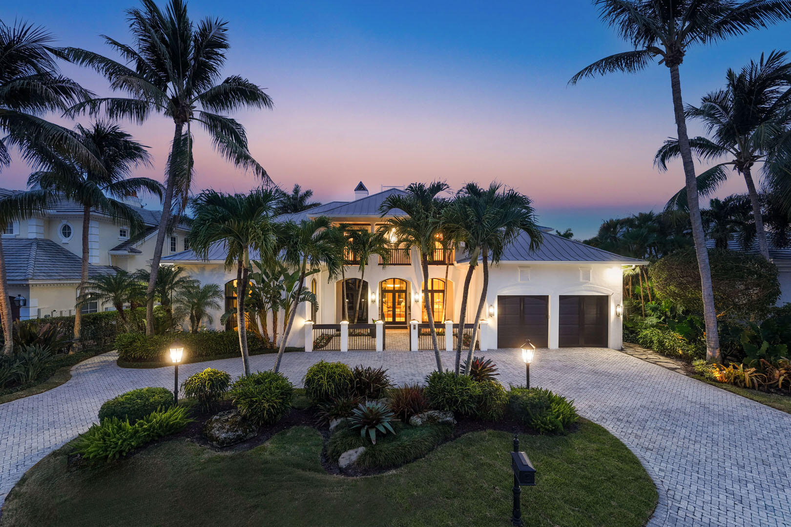 Inspired by the timeless elegance of British West Indies architecture, this extraordinary golf-front estate commands a premier setting with 88 feet of frontage overlooking three manicured fairways. Bathed in coveted southeastern exposure, the gated backyard captures sweeping vistas across the course, creating a private resort environment designed for both grand entertaining and everyday enjoyment. Spanning more than 7,300 square feet of thoughtfully curated living space, the residence offers five bedrooms, six full and two half bathrooms, and a collection of exceptional gathering spaces. Throughout the residence, refined finishes, natural gas amenities, abundant storage, and integrated Savant smart-home technology deliver comfort and convenience at every turn.   At the heart of the home, the gourmet kitchen is designed for culinary enthusiasts, featuring dual center islands, premium appliances, and effortless flow to the surrounding living and dining spaces. Entertaining reaches new heights in the state-of-the-art theatre room and expansive club room, complete with a full-service bar.   The outdoor experience rivals that of a luxury resort. A beach-entry pool and spa anchor the backyard retreat, while the covered summer kitchen is enhanced by a Tuscan wood-burning pizza oven, creating an inviting setting for alfresco dining against a backdrop of endless fairway views.   Designed to accommodate guests with complete privacy, the residence includes an exceptional VIP suite featuring its own kitchen, full bathroom, and private laundry facilities. Every element of this home has been carefully considered to deliver a lifestyle defined by comfort, entertaining, and exceptional golf course living.