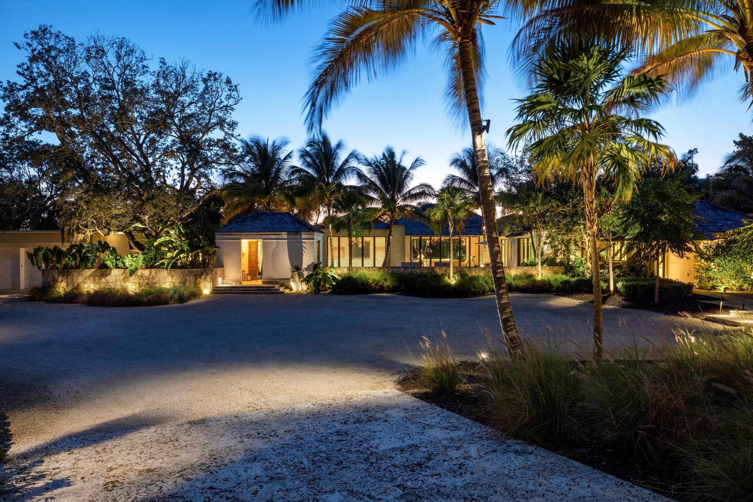 Known as River House, offered fully furnished & turnkey (excluding artwork), this newly completed riverfront estate sits atop a commanding 30-foot bluff in Sewalls Point, spanning 4.3 acres with sweeping, mile-long sunset views across the St. Lucie River. Designed as a modern Bahamian retreat, the residence blends imported Belgian materials with warmth and timeless elegance. Internationally recognized and featured in Vogue Australia for its exceptional design and craftsmanship. Complementing the offering, bespoke Seller Financing is available, including up to one-third of the purchase price, structured as interest-only for a period of up to five years, with no prepayment penalty, an uncommon and highly advantageous provision designed to accommodate a variety of acquisition strategies. Curated by Melhorn Architecture & Construction with interiors by Design Studio JAC, the estate reflects a level of intention and craftsmanship rarely achieved, resulting in a residence designed for longevity rather than trends. Dominican coral flooring, creamy lime plaster walls with Roman clay texture, and expansive walls of glass create a calm, gallery like backdrop for art and waterfront vistas. Vaulted ceilings accented by reclaimed European oak beams lend depth and permanence, while subtle variations in tone and texture define an atmosphere of quiet luxury.  Outdoor living is seamlessly integrated through impact glass wall systems, with a resort style pool, expansive deck spaces, and lush gardens extending the living areas into the landscape and down toward a private beach. Mature oak and banyan trees frame the setting, reinforcing the estate's sense of privacy, scale, and serenity.  A world class boating compound offers deep water dockage with multiple lifts, accommodating vessels over 100 feet with ease while providing direct access to the inlet and open ocean. The estate is further complemented by a private guest house, three garages with capacity for up to 17 vehicles, and meticulously designed grounds.  Thoughtfully curated from architecture to landscape, River House represents a generational waterfront offering. Timeless in design, rich in detail, and among the most distinguished estates in South Florida.