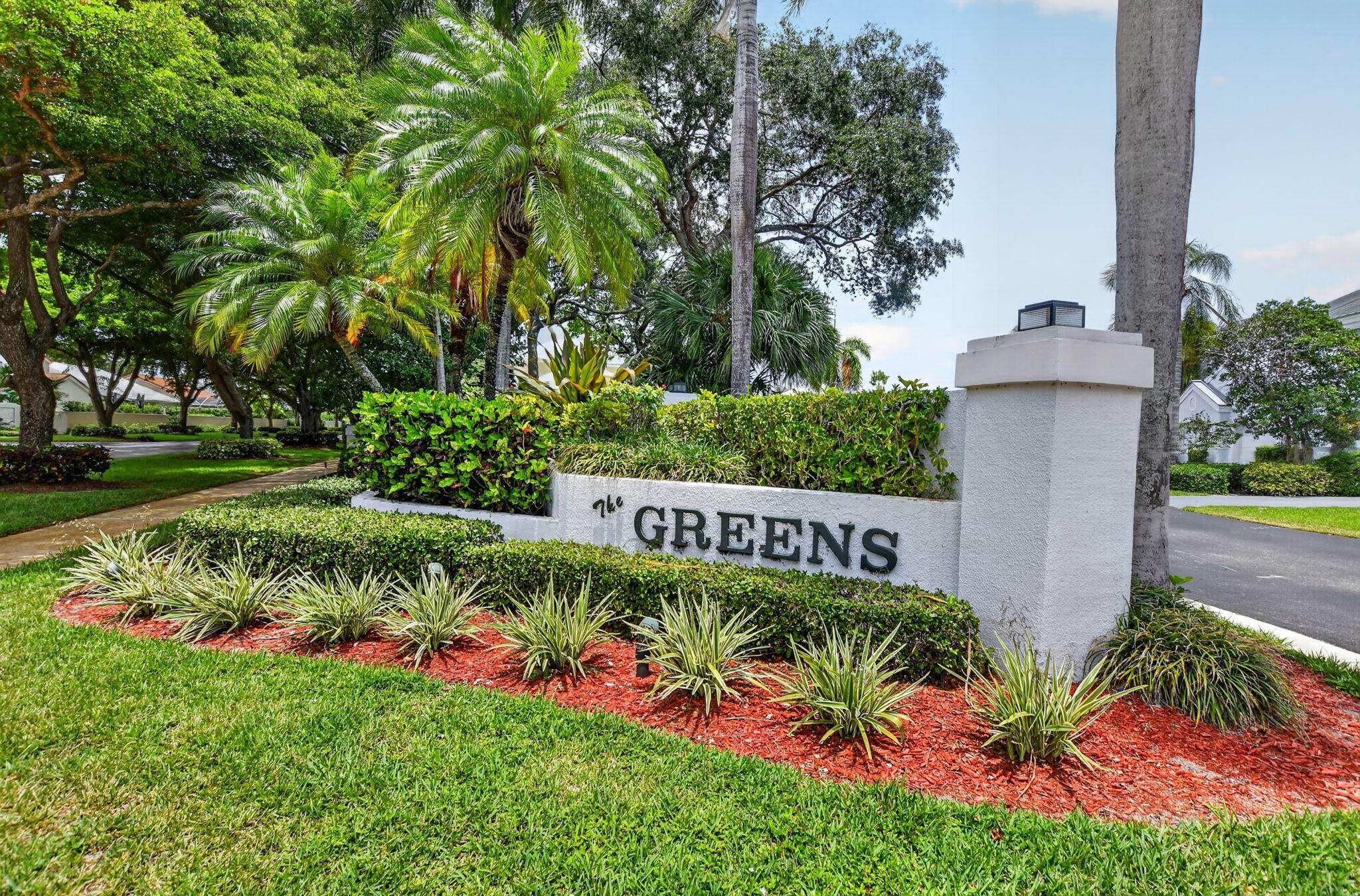 Discover this rarely available townhouse. Located in a 24hr manned gated club. This beautifully maintained 3BR 2.5BA townhouse, with large loft (easy conv to 4th BR). Features include ground floor primary suite, Updated kitchen with appliances and bathrooms , very attractive wood floors, 1 car garage and new metal roof. The Greens, sub- division includes a community pool. BCC offers a championship golf course with  no membership fee required. Pay as you play! Excellent schools, close to I95 and beaches. Must See