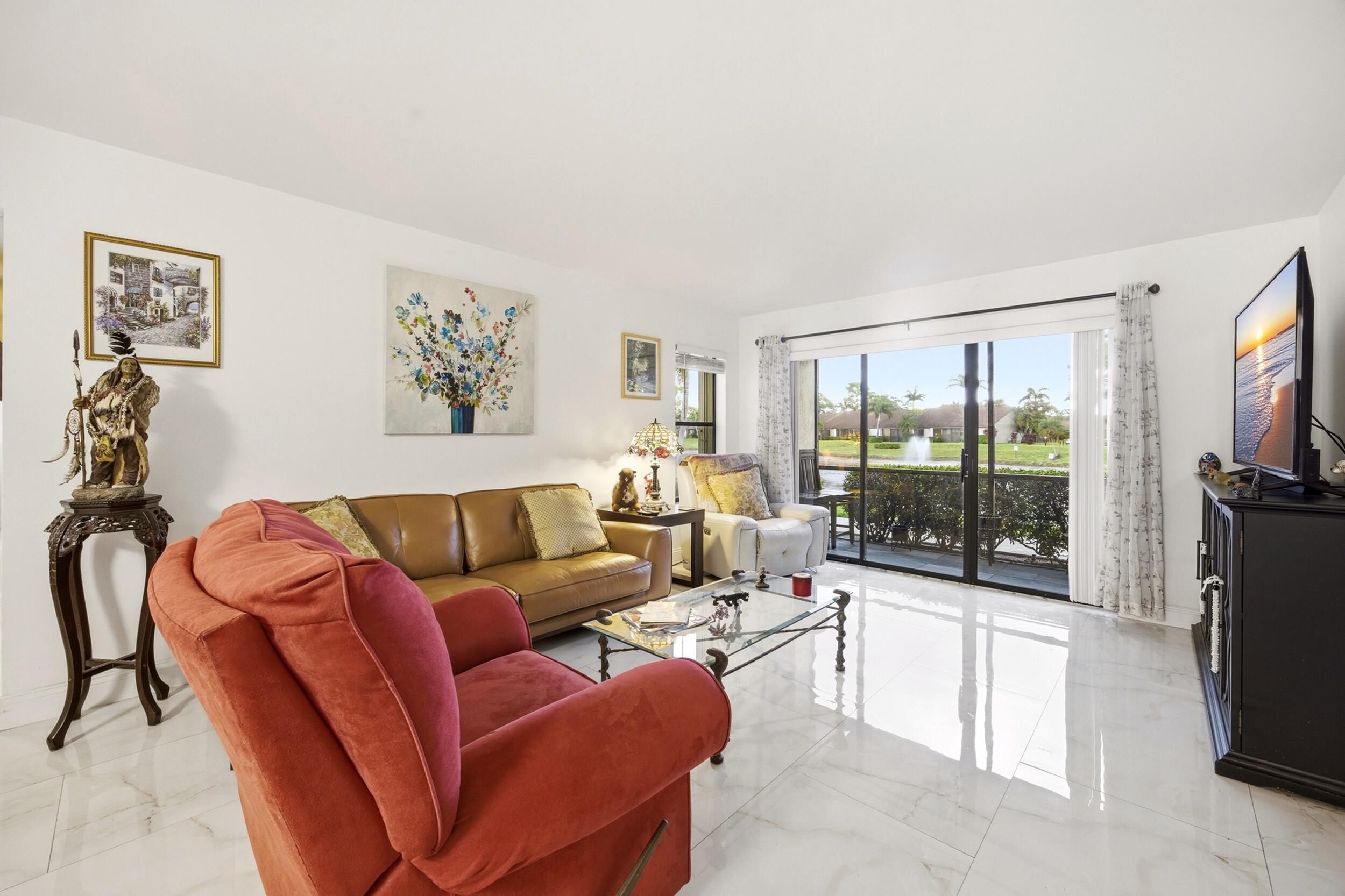 Beautifully updated 2-bedroom, 2-bath condo featuring a rare open-concept kitchen layout not commonly found in these units. The renovated kitchen offers a large center island, custom lighting, and plenty of space for entertaining. Updated flooring runs throughout the home, creating a modern and cohesive feel. Relax on the screened-in porch while enjoying stunning, unobstructed lake views. Conveniently located near great schools, shopping, dining, and major roadways, this move-in-ready condo offers the perfect combination of comfort, style, and location.