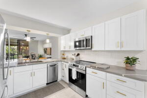 Stunning newly renovated 3-bedroom, 2-bath condo located in a desirable 55+ gated community with beautiful lake views. This move-in-ready residence features modern upgrades throughout, an open and inviting floor plan, and abundant natural light. Enjoy peaceful mornings overlooking the water and the security and amenities of a well-maintained gated neighborhood. Whether you're relaxing indoors or taking in the scenic surroundings, this exceptional property offers comfort, style, and convenience. This property will not disappoint!