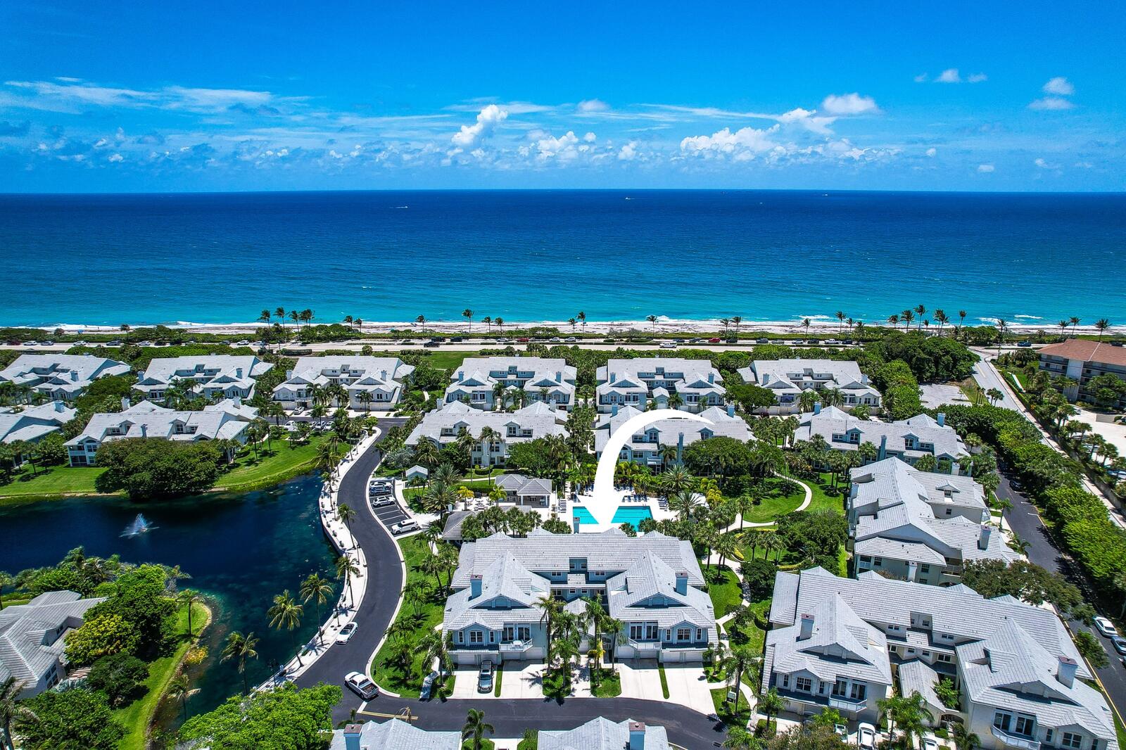 Completely renovated and designer furnished , this exceptional 2 bedroom 2 bath residence in Sea Colony offers a rare opportunity to enjoy luxury beachside living just steps away from Jupiter's pristine shoreline.   Thoughtfully reimagined from top to bottom ,the home features soaring ceilings, an open-concept floor plan, & high end designer finishes throughout. Eastern exposure fills the living spaces with beautiful natural light, while tranquil views of the tropical pool create a resort-like setting year-round.   The gourmet chef's kitchen is the centerpiece of the home ,showcasing premium appliances ,custom finishes,& an elegant design ideal for both everyday living & entertaining. Every detail has been carefully selected, from the newly installed  high-efficiency HVAC system with air   purification to luxury smart-home features and a state-of-the-art Japanese smart toilet.  Designer Restoration Hardware furnishings complement the sophisticated coastal aesthetic,creating a move-in ready retreat that feels more like a luxury resort than a rental property.   Sea Colony residents enjoy private beach access along with resort-style amenities including a pool, spa, tennis courts, pickleball courts, fitness center, and clubhouse. Located just moments from Jupiter's finest restaurants, golf courses, marinas, and shopping, this dog-friendly residence offers the perfect combination of luxury, comfort, and convenience.  Experience the best of the Jupiter beach lifestyle in a home where every detail has been thoughtfully elevated.