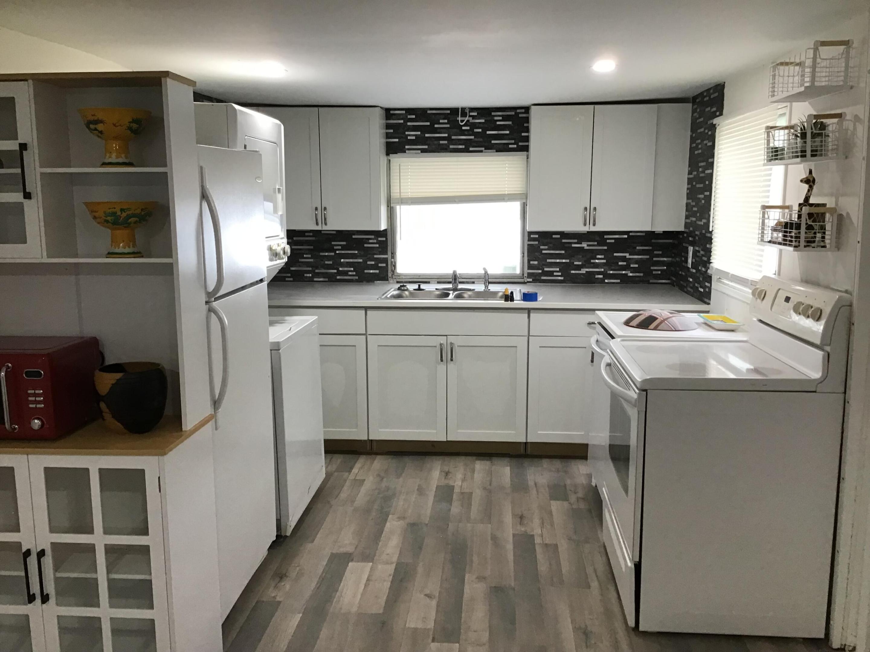Completely renovated manufactured home You own the land . No HOA fees or rules. There is a 1/1 and 2 studios  with bath and small kitchen. Tenant occupied  long term Cap rate 12% updated electric, water heater and HVAC. Seller financing available for the right buyer with $ 60,000 down and $2500 per month room for expansion