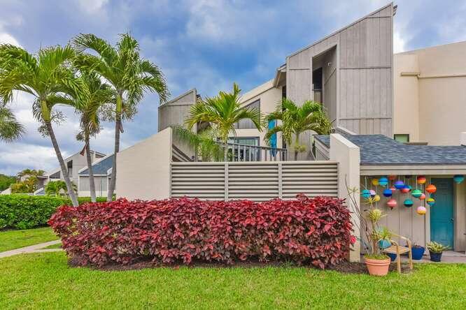 (ANNUAL RENTAL) Welcome to this beautifully updated corner-unit townhouse in the heart of East Jupiter. This turn-key two-bedroom, two-bathroom residence features an updated kitchen with stainless steel appliances, including an upscale Miele refrigerator, along with an in-unit Miele washer and dryer. Remodeled bathrooms and carpet-free flooring complement the light and bright interiors. Hurricane impact glass provides peace of mind, while multiple patios create ideal spaces for entertaining. Steps from Jupiter Beach and minutes from Carlin Park and DuBois Park, this location delivers the coveted coastal lifestyle you deserve. Furnished with modern finishes and effortless charm, this home is ready for immediate enjoyment. Schedule your private tour today.