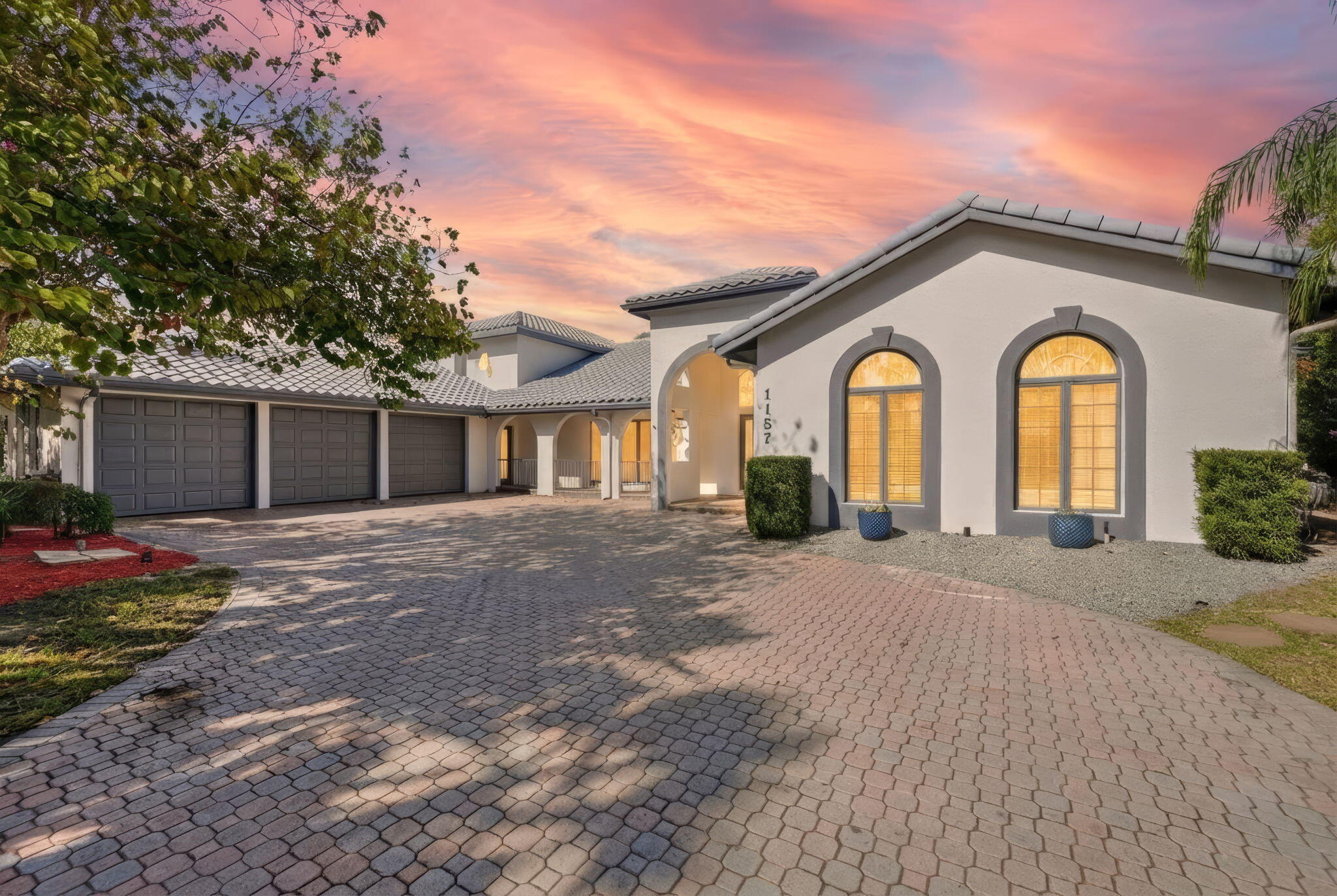 Come experience this impressive 6-bedroom, 5-bath residence with 4,371 sq ft under air, amazing Screened Pool/Spa and stunning lake view. Located in the gated Country Club Estates, surrounded by stunning lake and golf course views. This home is one of the largest floor plans in the community! The home features a forma living room, family room, three guest bedroom and primary suite all on the main level. The updated kitchen features newer cabinetry, granite countertops, center island w/ new cooktop, abundant storage, a large walk-in pantry, and an gourmet wine cooler—ideal for entertaining. 
The first-floor primary suite offers French doors to the patio, a walk-in shower, separate tub, and generous closet space. Step outside to an expansive 82' x 18' SCREENED POOL and jacuzzi that is perfect for summer fun and family time. Lush tropical landscaping on a .33-acre lot. Beautiful S-tile roof replaced in 2011, and many upgrades and updates. Additional highlights include a cabana bath, a Jack-and-Jill bath, a gas fireplace, a central vacuum, and a massive 3-car garage with golf cart access. Outstanding community with golf, clubhouse, and low hoa fees. Top St Lucie West location convenient to golf, shopping, schools, dining, and easy access to I-95.