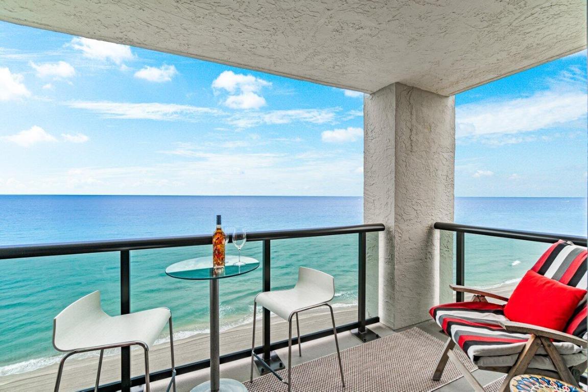 DIRECT, UNOBSTRUCTED PANORAMIC OCEANFRONT, Serene Retreat: Experience true beachfront lifestyle in this exquisite, Southeast Corner, DIRECT ocean facing, 3 bedroom/2.5 bath condo directly on the sand in prestigious Highland Beach. Relax as soon as you step into this lower penthouse residence, with sweeping, calming views of the Atlantic Ocean from every room and balcony. Wake up to the serenity of gently breaking waves and stunning sunrises. Segue into tranquil moonlit ocean nights with enchanting twinkling city lights and sunset views, west. Put on your flip flops and saunter down to your exclusive beach—for relaxed sunbathing and swimming or for evening moonlit strolls. This enticing condo is airy, light, and bright. It features new AC and water heater, seamless flow between living, dining, and kitchen areas, with casual, kitchen-bar and bistro-style seating as well as more formal dining for 8-10...and endless, magnetic ocean views & sounds. The spacious primary suite has its own "Juliet" balcony for private reflective moments, a large en-suite bathroom, and his/hers walk-in closets with fully-mirrored dressing area. Two more ocean-facing bedrooms each have their own special touches with large shared Jack-and-Jill bathroom. There is an additional half bath/powder room adjacent. Hurricane-impact windows and doors. 2 deeded prime-location, covered & gated parking spaces.  Savor morning coffee or evening cocktails on your private oceanfront balcony, lounge at the resort-style pool or on your exclusive beach, or take a 5 minute stroll along the water's edge to the Delray Sands Hotel oceanfront Latitudes Bar and Fine Dining Restaurant. This boutique condo community offers a host of other amenities, including a fully, well-equipped, fitness center suitable for general wellness to elite performance, doormen, 24-hour high-tech keyless access system, private beach access with building-exclusive chairs and loungers, new beach shower area, car wash area, sauna, ev plug access, club room, individual, secured storage areas for each condo, PET FRIENDLY, AND ABLE TO BE RENTED IMMEDIATELY.  Ocean Terrace North has completed its multi-million dollar concrete restoration and has many renovated interior and exterior features. Additionally, Milestone Phase 2 work is completed and Structural Integrity Reserve Study (SIRS) work is up to date.  Ocean Terrace North is perfectly situated on the sand and with easy access to Boca Raton, Delray Beach, Ft. Lauderdale and Palm Beach dining, shopping, entertainment options, and international airports. This is the perfect opportunity to own your own exclusive piece of paradise without compromise. Don't miss out on this rare oceanfront gem!