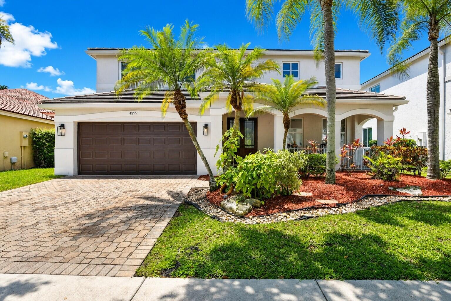 Like straight out of a Restoration Hardware magazine, this modern 4BD+DEN/2.5BA NEWLY RENOVATED (2026) residence sits on a picturesque fully fenced LAKEFRONT with resort backyard, sparkling POOL & serene water views. With farmhouse chic elegance, this home truly shows model perfect! NEW 2023 FLAT ROOF, FULL IMPACT GLASS 2024, designer lighting, smooth ceilings/walls, freshly painted inside/out 2025, new Swiss wide plank flooring, custom baseboards, brand-new remodeled white/gold kitchen with new cabinetry, modern hardware, backsplash & walk-in pantry. ALL NEW SPA-LIKE BATHROOMS. Generous covered patio with retractable awnings, sunshades & expansive lawn, enhance the outdoor living. 2026 water heater, 2 ACs, custom closets, garage storage. Comm clubhouse, parks & top Weston schools nearby! ****WELCOME HOME TO THE RIDGES of WESTON, a highly sought after double guard gated community, desired for its close proximity to Weston's top educational, recreational and medical facilities! Nestled within the tree-lined streets of the enclave of Laurel Ridge, lies this most STUNNING, IMPECCABLE BRAND NEWLY RENOVATED 4-bedroom plus versatile den, 2.5-bath, 2CG waterfront residence, that offers 2,573 square feet of spacious comfortable living on a spectacular lakefront lot with a sparkling pool. ********* Thoughtfully curated with warm organic Restoration Hardware inspired farmhouse elegance, the home showcases an extensive collection of premium upgrades that checks off all the boxes for today's discerning buyer, offering peace of mind with a NEW FLAT TILE ROOF (2023), COMPLETE IMPACT WINDOWS & DOORS (2024) and brand-new hot water heater (2026). ***** The interior is light, bright and airy with fresh crisp white paint (2025), new designer lighting fixtures, new LED recessed lighting and new smoothed walls and ceilings. The exterior was also freshly painted (2025), and features a charming full-length front porch, new modern coach lights and refreshed landscaping. The fully fenced and hedged backyard oasis is an entertainers delight, with an expansive lawn for play, large freeform pool with large sun-shelf, a generous covered patio with two modern ceiling fans, retractable awnings, as well as moveable sunshades on either side of the patio for a cozy vibe, all with serene lake views as the perfect backdrop for South Florida outdoor living. ******  The brand-new May 2026 renovation introduces luxurious Swiss wide plank flooring throughout the first level and stairs, custom pine baseboards, a beautifully refreshed chef's kitchen adorned with white shaker-style cabinetry, brushed gold modern hardware and designer faucet, an organized walk-in pantry and an oversized stacked white subway tile backsplash.  Enjoy all brand-new spa-inspired remodeled bathrooms, featuring quartz counters and custom maple vanities with soft-close cabinetry. The primary suite features double custom walk-in closets and leads to a spacious den, perfect for a home office or fitness studio. The magazine-worthy renovated primary bathroom (May 2026) features new plank flooring, new seamless glass shower, new tile, new quartz vanities, new mirrors, new hardware, wall niche, and designer slat-paneling on the walls. Each bedroom features plantation shutters and custom closets, and all have been thoughtfully designed for comfort and relaxation, with two of the bedrooms offering spectacular lake views. ******** Additional highlights include 2 AC units, upgraded appliances (2021), custom closets, garage storage systems, new modern coach lights, and an extra full-size refrigerator. Exceptional walkability to top-rated schools including Falcon Cove Middle School and Cypress Bay High School, as well as the Weston Library. Down the road, enjoy the community clubhouse with resort pool, kiddie pool, ball parks and clubhouse. Near to shops, outdoor cafes, restaurants, boutiques, athletic and recreational facilities, as well as renowned medical facilities such as Cleveland Clinic, Baptist Health and the Broward Medical Center. Quick highway access to Miami, Ft. Lauderdale, Naples and the Palm Beaches. Welcome to a residence that balances refined functionality with the South Florida lifestyle. Welcome home to Weston!