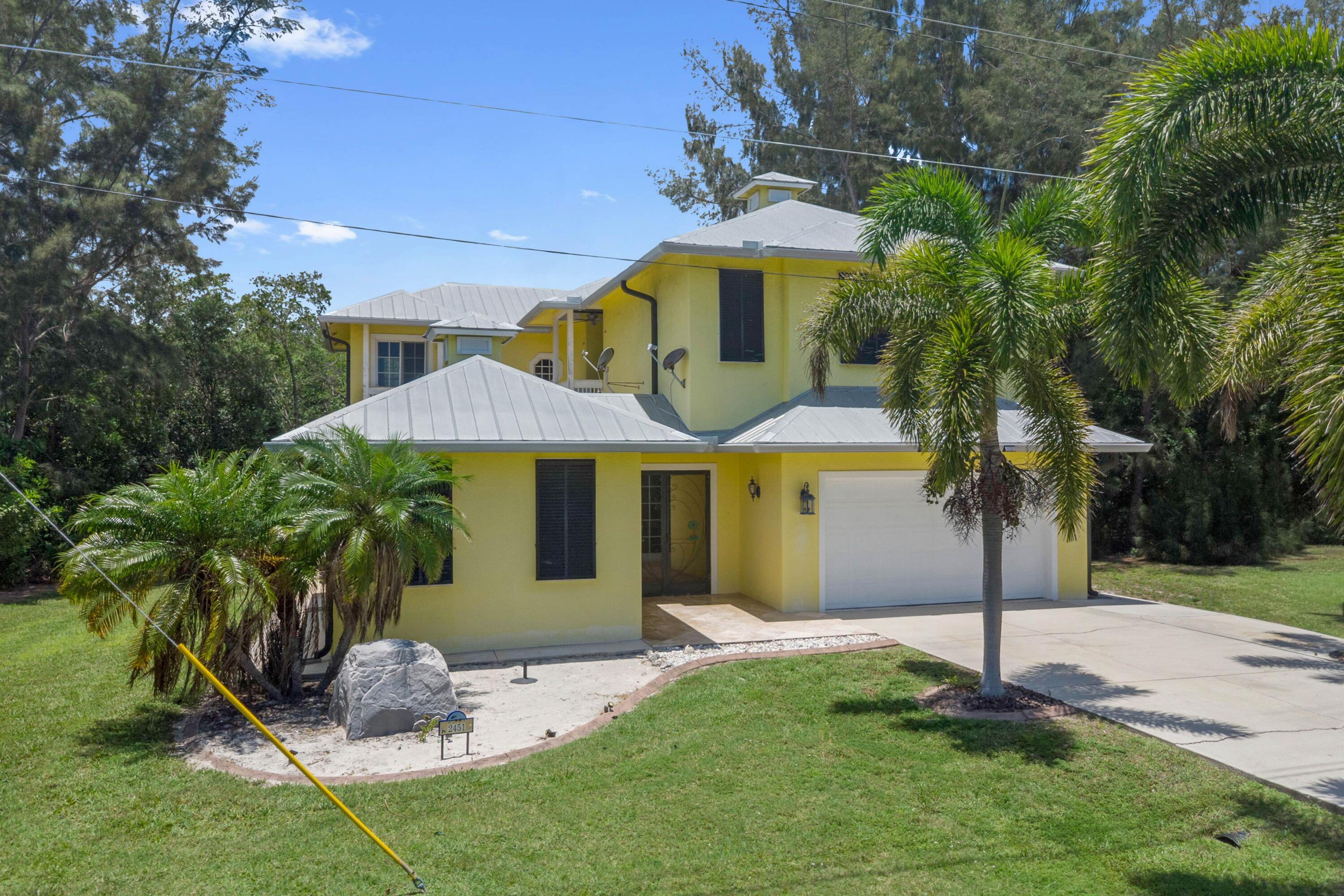 Welcome to this impressive 4 bedroom, 3.5-bath courtyard beach house on Hutchinson Island inclusive of 1/1 guest house.  Just a short stroll to the beach and no HOA fees! Spanning 3,461 square feet across two stories, this single-family home offers substantial living space designed for comfortable living. Hardwood flooring on the main level, chef's dream kitchen complete with stainless steel appliances, huge granite top center island and large pantry.  Whether your searching for privacy or a great home for entertaining - this is it!