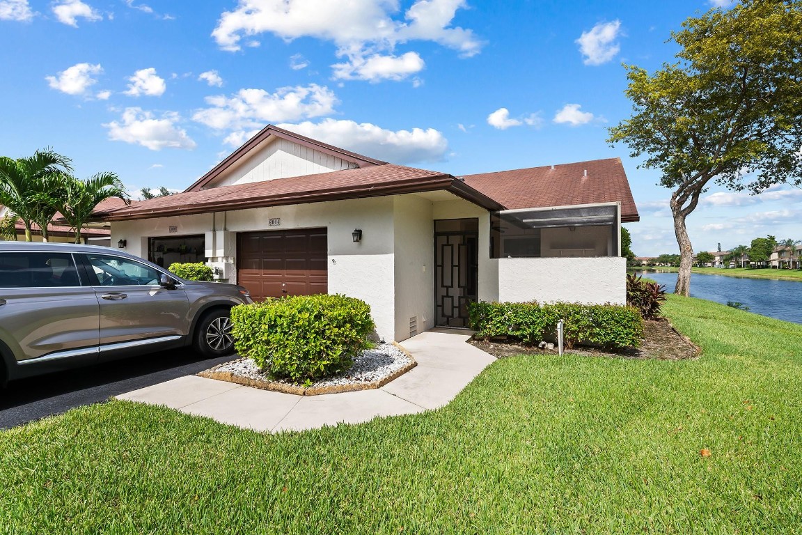 Welcome Home to this rare 2 bed, 2 bath villa.  Home features an additional den which could be a a third bedroom, one car garage, back covered patio, front enclosed patio, and water views from the front side and back.Do not miss the opportunity to call this house your home