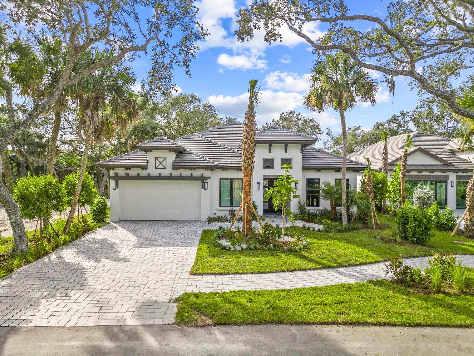 Experience the pinnacle of island living w/ the Sapphire model, which is currently available for purchase. This home encompasses over 2,700 sq. ft. of living space & includes impressive upgrades & finishes throughout. Notable features consist of a club room complete w/ a pool table, a spacious great room enhanced by a fireplace surrounded by quartz & includes a bar with a beverage center. The chef's kitchen is expertly designed showcasing an oversized island equipped with w/a wine cooler, a built-in oven & microwave, a gas range accompanied by a second oven, & a 48-inch Café side-by-side refrigerator. Moreover, the outdoor area is ideal for hosting gatherings, offering multiple seating areas around a pool adorned w/3-copper scuppers and a sun shelf.