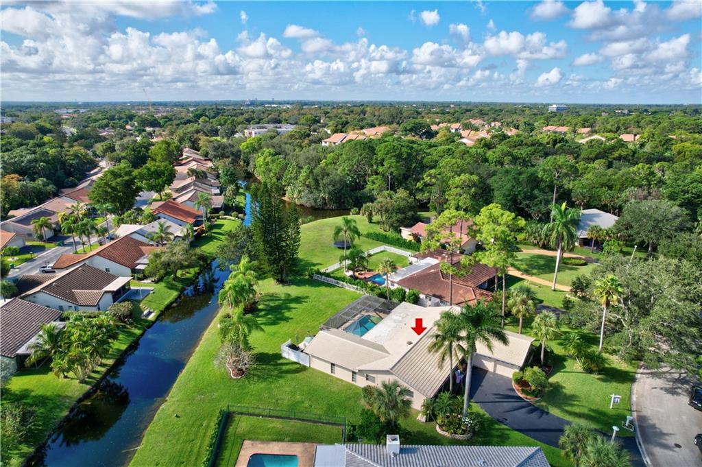 Who's hosting Christmas this year? YOU ARE!! *OVERSIZED 1/3 ACRE LOT (15,291)* This spacious 4/2.5 waterfront/pool home features: split AC system, partial impact windows, updated kitchen w/SS appliances, breakfast area, vaulted ceilings w/recessed lights, formal dining & living room, family room, fireplace, tile & laminate floors, Master suite boasts walk-in built out closet, dual cabana baths w/dual sinks in both, vanity & step-in shower. Your backyard oasis is surrounded by lots of green space w/covered patio & screened-in pool,(wet bar & refrigerator), perfect for entertaining year around. Alarm system, ring doorbell w/motion lights & smart garage door opener. Irrigation system fed from canal. Best of all No HOA! Close to shopping, dining, schools, parks & Sawgrass **OVERSIZED 1/3 ACRE LOT (15,291 sq ft)** This spacious 4/2.5 waterfront/pool home features: 2014 split A/C system, 2021 water heater, partial impact windows, updated kitchen w/SS appliances & Silestone counters, breakfast area, vaulted ceilings w/recessed lights, formal dining & living room, family room, fireplace, tile & laminate floors, Cabana bath w/dual sinks and Master suite boasts walk-in closet, cabana bath w/dual sinks, vanity & step-in shower. Your backyard oasis is surrounded by lots of green space w/covered patio & screened-in pool, (wet bar & refrigerator included), perfect for entertaining year around. Included: Alarm system, ring doorbell w/motion lights & smart garage door opener. Irrigation system fed from canal. Best of all No HOA! Close to shopping, dining, schools, parks & Sawgrass