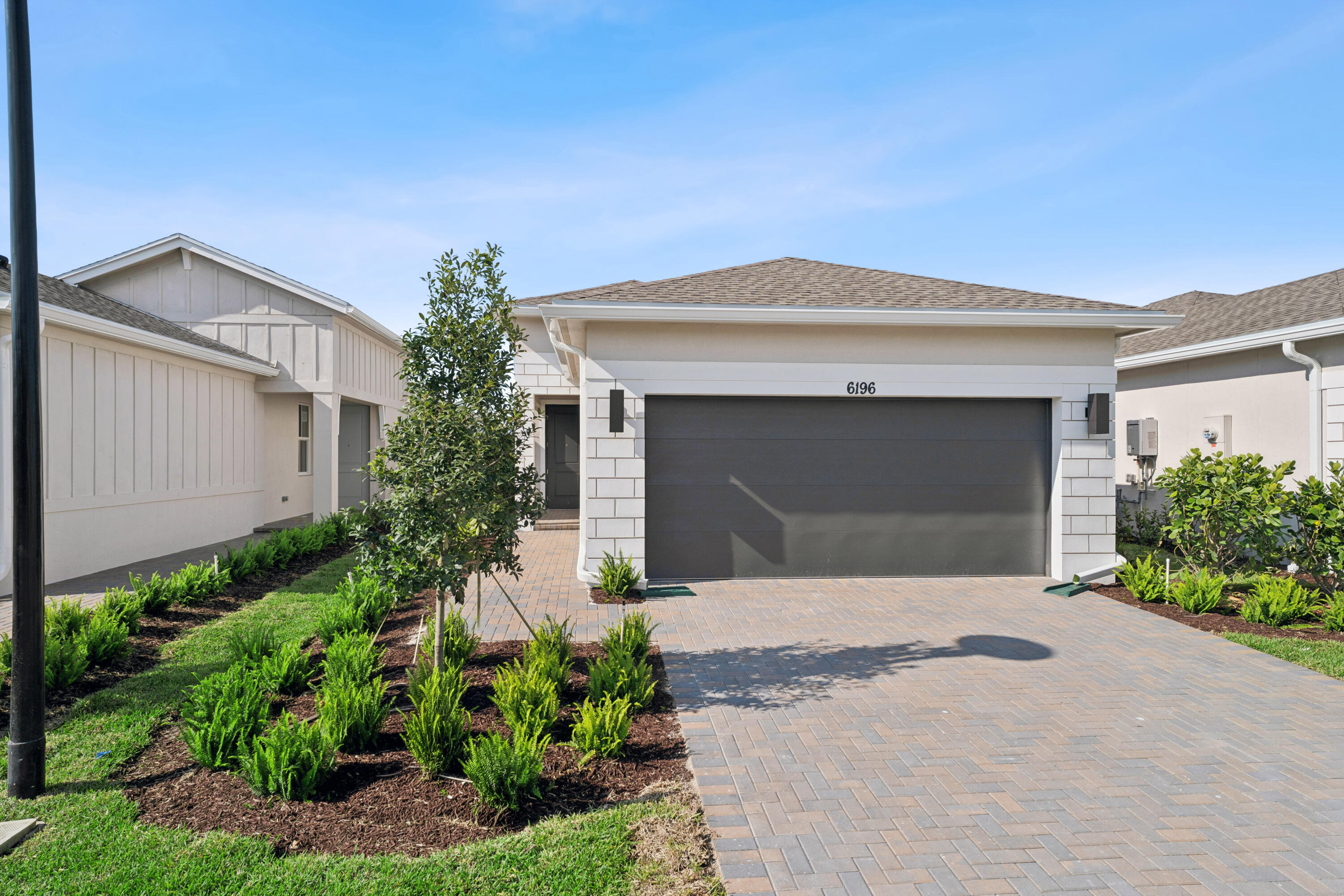 Stylish Spring Lake IV in 55+ Community with Lake Views & Resort-Style Amenities

This Spring Lake IV is designed for effortless living and entertaining. The open kitchen, dining area, and great room offer a seamless flow, with the dining area and great room sharing a sleek ceiling treatment that adds modern elegance. The kitchen features a quartz island perfect for meal prep and casual seating.

Step through the 12' multi-slide door to the covered patio and take in the serene lake views, ideal for relaxing or entertaining outdoors.

The primary suite is a tranquil retreat, highlighted by a refined ceiling treatment, while the private primary bath includes dual sinks and contemporary finishes for everyday luxury.

A home office provides a quiet, functional space for work or study. Located in a 55+ community, residents can now enjoy resort-style amenities that are open and ready for leisure, fitness, and social activities.