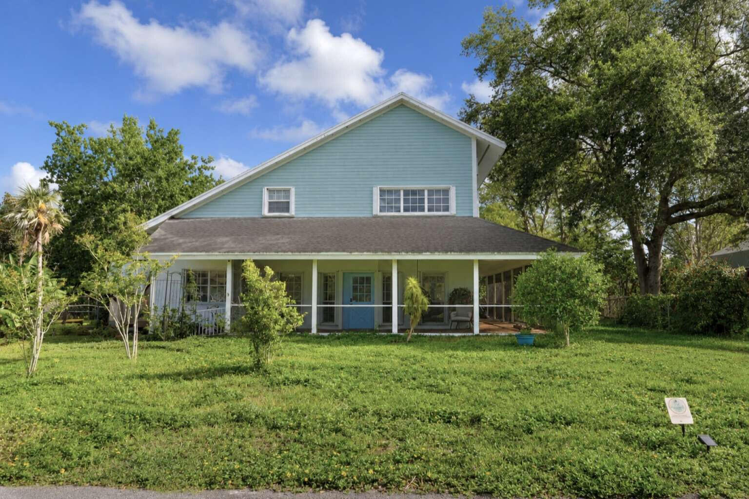 Rare Redlands Farmhouse | Private Estate | No HOA Wake up to cathedral ceilings, warm wood, and a backyard that feels like a private nature preserve. This is Redlands living at its best: a 2,512 sq ft two-story farmhouse on a lush 0.39-acre lot with mature oaks, tropical landscaping, and zero HOA restrictions. The kitchen and living area features soaring vaulted ceilings, freshly painted white cabinetry, brushed brass hardware, LED uplighting, center island with cooktop, and all appliances included. Five impact-rated French doors connect the main living spaces to dual screened lanais wrapping the home front and back. The master suite offers vaulted ceilings, a walk-in closet, soaking tub, plantation shutters, separate shower, and double vanity with brushed gold fixtures. The outdoor oasis includes a handcrafted koi pond with wooden footbridge, young mango, lemon, sugar apple, and fig trees, a 200 sq ft workshop, and a fully fenced backyard built for privacy and lifestyle. CBS construction, hurricane shutters on all windows, 5 impact French doors, new downstairs HVAC, new water softener, 1-car garage, roof certified with documented remaining life, and all appliances convey. This property is one of a kind in the Redlands, with a distinctive combination of character, privacy, and upgrades at this price.
