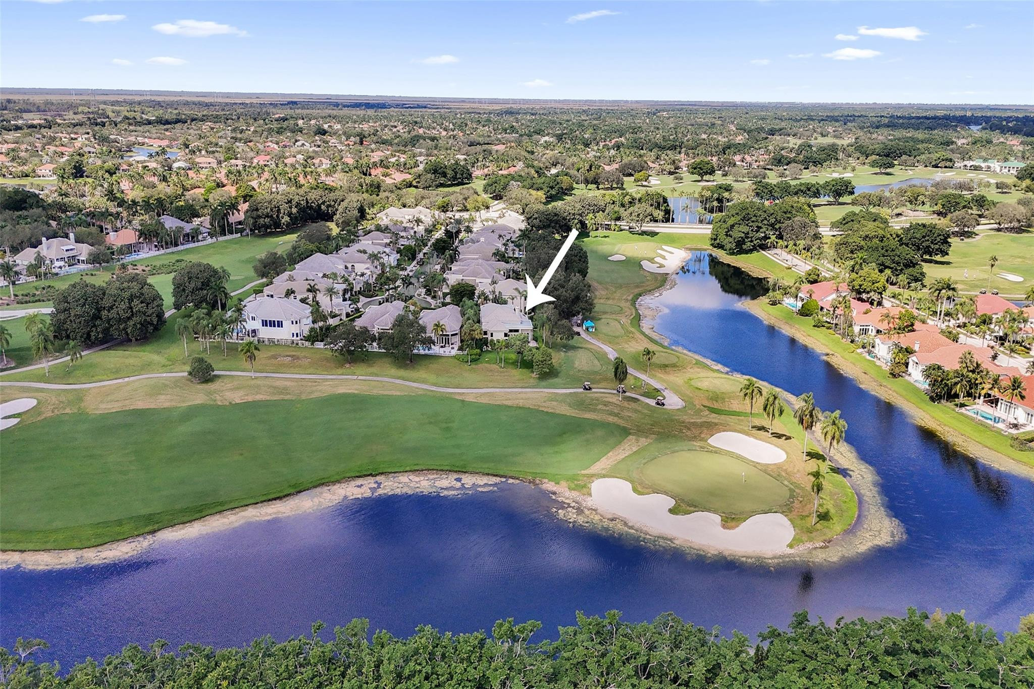 Nestled on one of the most coveted PANORAMIC PREMIUM GOLF & LAKE lots in all of Weston Hills, this magnificent home sits on a cul-de-sac in the exclusive boutique enclave of The Fairways. A long paver driveway, flanked by high privacy hedges, leads to 3600SF of timeless elegance with soaring 20-foot ceilings & breathtaking wraparound views of the TOUR COURSE through floor-to-ceiling glass walls that seamlessly connect the grand interior to the stunning surroundings. Primary & custom den downstairs; upstairs, 2BD w/bath. Exquisite chandeliers, custom mirrors, solid hardwood flooring, plantation shutters, double-sided fireplace. NEW UPDATES incl BRAND NEW IMPACT sliding glass doors & plank floors (Fall 2025), 2024 tankless WH, 2024 flat roofs, 3 NEW AC units, plumbing, $25K landscape & more! The thoughtfully designed 4Bed (including custom built-in office), 3 Bath, 2CG was designed to bring the outdoors in, where walls of glass seamlessly connect the interior to the stunning surroundings. Downstairs, the spacious primary suite features new luxury plank flooring, custom closets, a double-sided marble fireplace and sitting room that overlooks the fairways, as well as a spa-like marble primary bathroom ensuite. The 4th Bedroom, also downstairs, is outfitted as a beautiful home office, with custom solid wood cabinetry and shelving, and a large walk-in closet, with adjacent bathroom. On the upper level are two huge bedrooms, both adjoined by a spacious bathroom.Significant investments between 2023-2025 include brand new impact glass doors (living, family, primary) in Fall 2025, new luxury plank flooring (2025), freshly painted bedrooms, bathrooms and all baseboards, a 2024 tankless water heater, extensive plumbing updates and three newly installed flat roofs (2024). The home is climate-controlled by three newer A/C units: a 2.5-ton unit (2021) for upstairs, a 2-ton unit (2022) for the primary suite, and a powerful 5-ton unit (2024) for the living areas. Additional updates include new laundry room sink, new garage door opener and springs (2025), new sensors (2023), a newer side door from the garage, updated sprinkler system and gutters for the entire home, and $25,000 in professional landscaping. This property represents the ultimate in luxury, comfort, and peace of mind, all set against the backdrop of unmatched golf and lake views. With optional country club membership at The Club at Weston Hills, walkable distance to the trendy Weston Town Center and top-rated schools nearby, the best of South Florida living awaits you, welcome home!
