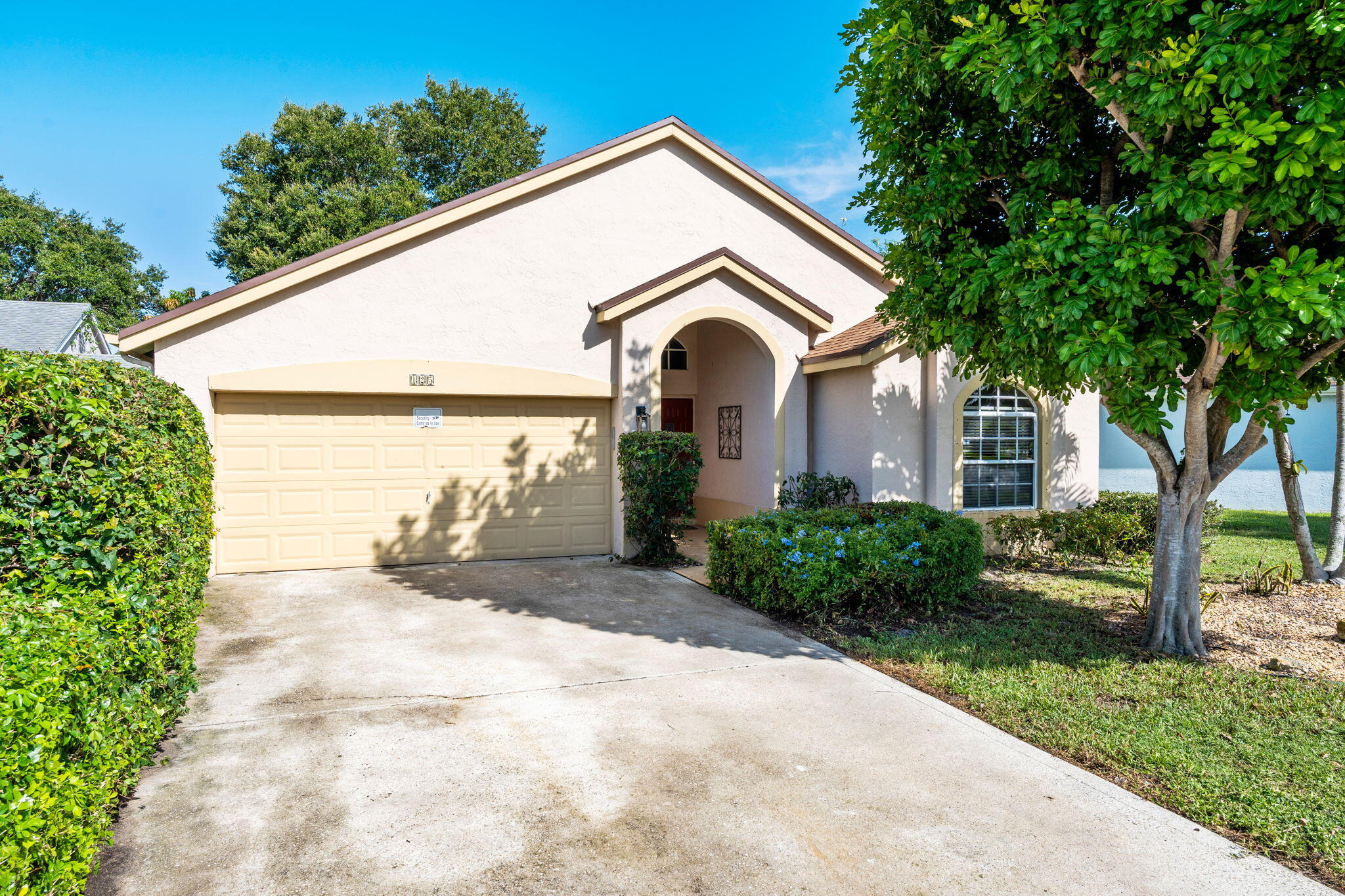 Welcome to Saratoga at Royal Palm Beach! This well-maintained 3-bedroom, 2-bath CBS home offers 1,758 square feet of thoughtfully designed living space under air. Enjoy peace of mind with a 2018 roof, 2022 A/C, and 2020 water heater, allowing you to move in with confidence. The split-bedroom floor plan provides both privacy and functionality, while the open-concept living and dining areas create the perfect space for everyday living and entertaining. The updated kitchen, renovated in 2020, features modern finishes and overlooks the main living areas. Step outside to an oversized backyard with plenty of room for hosting family gatherings, barbecues, or creating your own private outdoor retreat. Complete with a 2-car garage, this home is located in a quiet, affordable community just minutes  from top-rated schools, parks, shopping, dining, and major commuter routes. A fantastic opportunity to own a spacious, move-in-ready home in the heart of Royal Palm Beach.