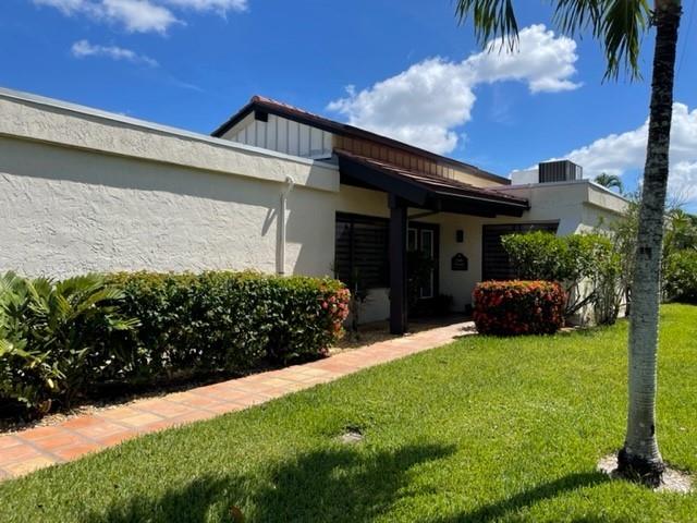 ***Continuing to show as a BACK UP!!!  Gorgeous 2 bedrooms, 2 bathroom with and an attached 2 car garage. The home has a substantial amount of upgrades and renovations to include the kitchen cabinets, quartz counters in kitchen, stainless steel appliances,  A/C and the flat roof that was completed in 2021. Main roof was replaced in 2012. Both bathrooms have been completely upgraded and there is luxury vinyl plank flooring throughout. This home is in a 55+ resort style, gated community with numerous amenities including a clubhouse, pool, golf, spa, fitness center and tennis. The community is conveniently located close to shops and restaurants! **No mandatory membership is required but optional memberships are available. This home is owner occupied and will require an approved showing confirmation in order to show this property.  Showings are allowed all day Wednesdays and Saturdays and anytime after 5:30 pm every other day.  Home is not on lockbox/Supra and owner will provide access into home.  ***To schedule a showing you must provide a minimum of 1 hour notice and please text listing agent (561) 302-7057 your information, time and date for showing and wait for confirmation.