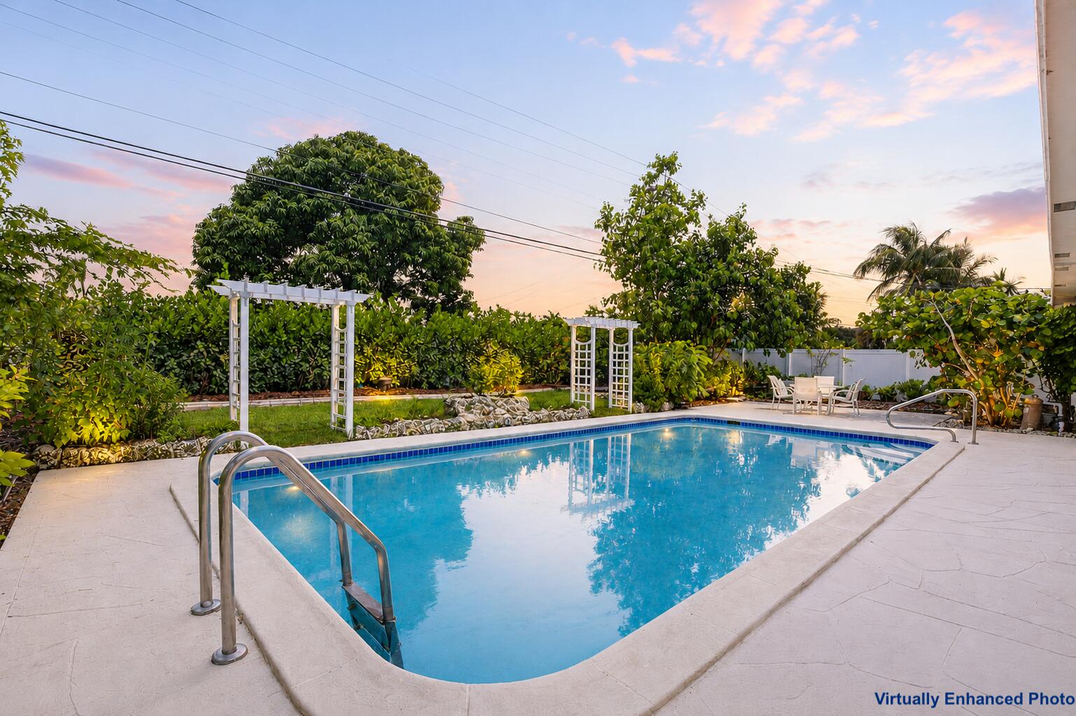 Welcome to this beautifully updated 3-bedroom, 2-bathroom pool home in the highly sought-after Boca Square neighborhood of East Boca Raton. Located just a short distance to Addison Mizner School (K-8), this move-in-ready home combines modern updates, designer finishes, and an exceptional outdoor lifestyle. The private backyard is a true highlight, featuring a resort-style pool, covered patio, multiple entertaining areas, and a lush butterfly and pollinator garden. Mature orange, lemon, and banana trees, along with a chef's herb garden, create a peaceful tropical setting. Dominican coral stone and custom hardscaping enhance both the front entry and pool area.  Inside, the remodeled kitchen features quartz and Brazilian quartzite countertops, a GE Profile stainless steel appliance package, and an open layout that's perfect for everyday living and entertaining. The primary suite includes a beautifully renovated bathroom with Thassos marble, Belgian bluestone, and a pebble-stone shower floor. Major updates completed in recent years include a new flat roof (2023), water heater (2024), A/C (2025), pool pump motor (2024), remodeled kitchen and primary bathroom, updated flooring, millwork, lighting, landscaping, and more. A 2-car attached garage provides added convenience. Boca Square is one of East Boca's most desirable neighborhoods, known for its family-friendly atmosphere, no HOA, oversized lots, and convenient access to beaches, downtown Boca Raton, Mizner Park, shopping, dining, I-95, Brightline, and East Boca resident beach privileges. A rare opportunity to own a thoughtfully updated home in an unbeatable East Boca location.