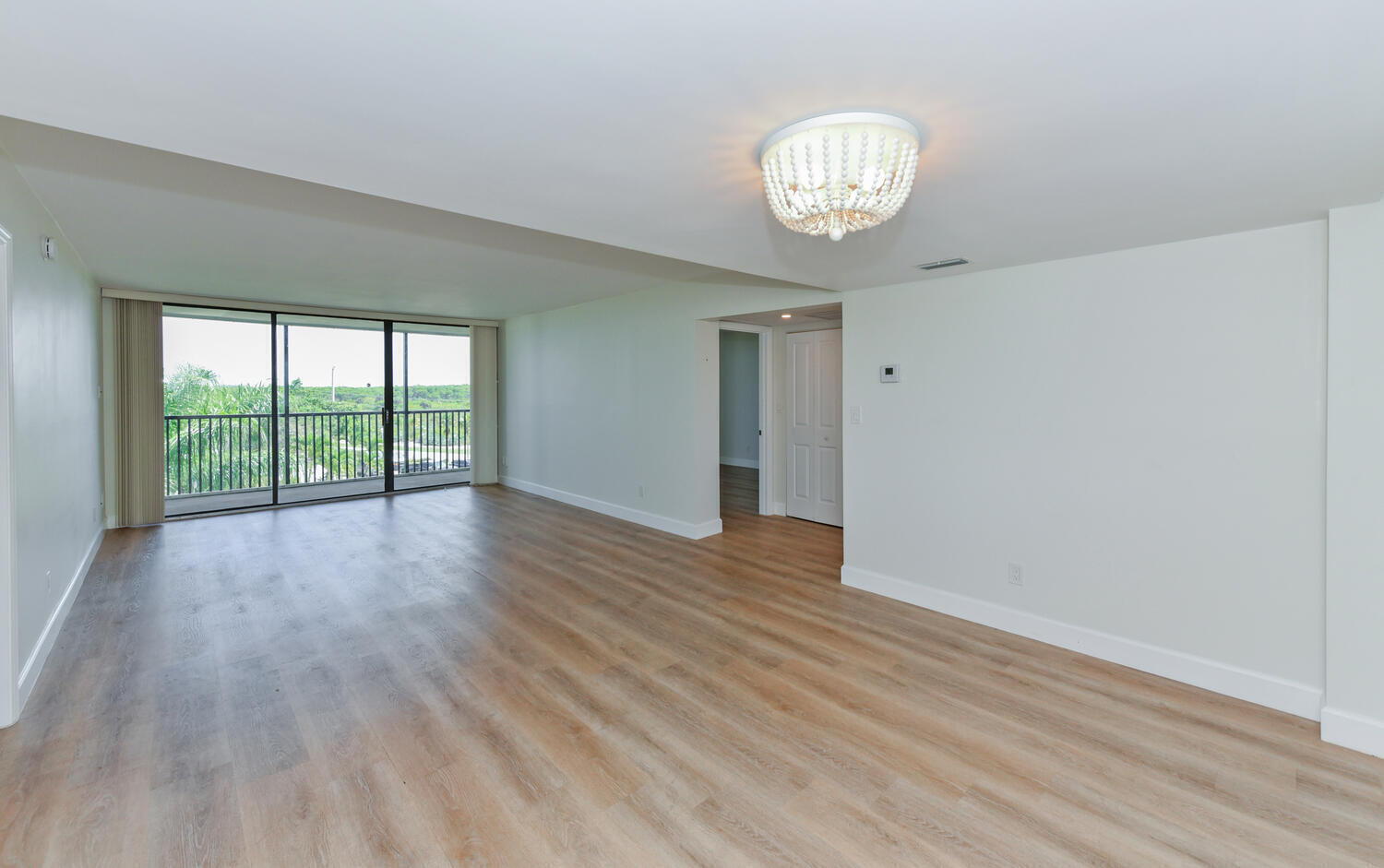 This distinguished two-bedroom, two-bathroom condominium presents an exceptional combination of refined coastal living and compelling investment potential. The residence features a thoughtfully updated kitchen, professionally remodeled bathrooms, and light laminate flooring throughout, establishing a luminous and move-in-ready environment. Situated mere steps from Jupiter Beach and the scenic Carlin Park, the property affords effortless access to pristine shorelines, distinguished dining establishments, and premier shopping destinations. Whether one seeks a permanent residence, a seasonal retreat, or a reliable rental income opportunity, this offering merits serious consideration. Explore distinguished coastal living within one of South Florida's most coveted communities.