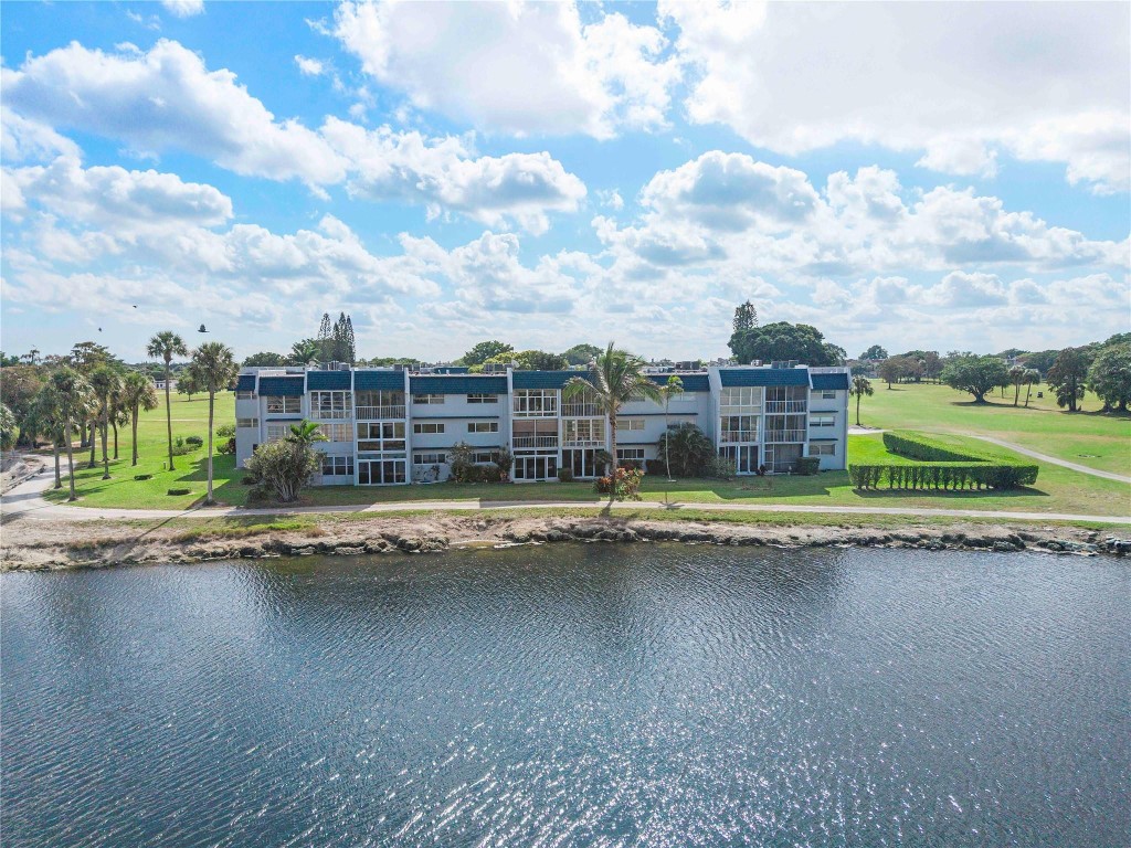 Fully furnished 2-bed, 2-bath condo on the second floor featuring stunning golf course and water views. Enjoy a spacious living area with impact windows and sliding door, plus a Florida room overlooking the golf course. The A/C was replaced in 2024 for added comfort and peace of mind. Located in a well-maintained 55+ community offering great amenities, including a pool, clubhouse, shuffleboard, and more. Monthly fees conveniently include internet, cable, and reserves.